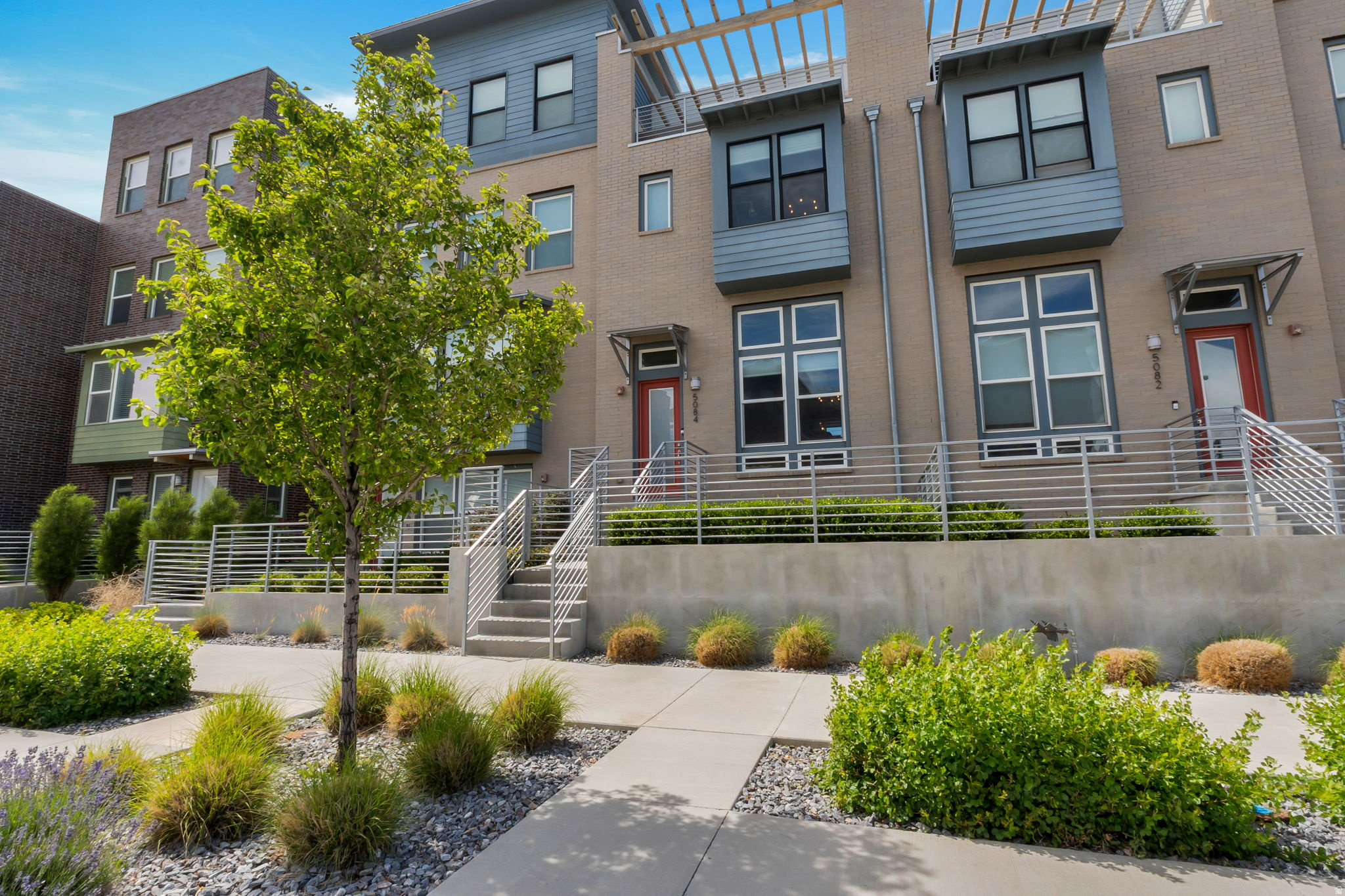 Experience the best of Daybreak living in this stunning townhome, featuring a fully-fenced front yard and an expansive sky deck complete with reinforced flooring and outlets for a hot tub, a dedicated gas line for a BBQ or fire pit, and beautiful views of the Wasatch Mountains. Located just minutes from Oquirrh Lake, you can easily enjoy summer kayaking and miles of scenic lakeside walking trails right outside your door. This prime location offers unparalleled convenience with close proximity to SoDa Row, diverse shopping and dining, a movie theater, Trax, and the University of Utah Health Center.Beautiful Daybreak townhome with so many upgrades!  Coming down you have bedroom floor with 3 well apportioned bedrooms, including a primary with a walk in closet and en suite with double sinks and beautiful euro shower. Main bath with over sized soaker tub and shower.  Wow! Laundry on this level also. Shiny quartz counter tops throughout. Durable and nice laminate flooring from the entry up thru the dining room and kitchen. Balcony on the back of home also. Black stainless appliances all stay in kitchen. Vaulted ceilings and well lit. Over 400 feet of storage in unfinished basement. Some units have set this up as a workout room. Metal railing upgrades make this unit modern and functional.  Come and check it out right now!