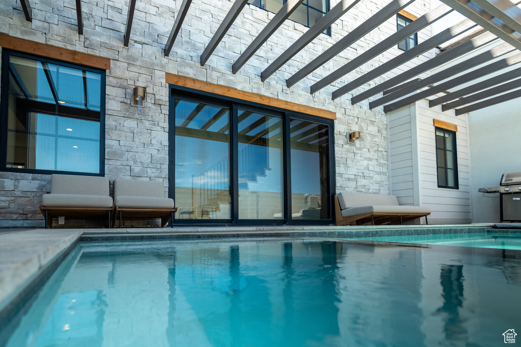 How is a Co-Ownership Vacation Home sold in 1/8th Ownership. Imagine four weeks a year of 360 degree sun soaked views from your private roof-deck. This iconic 5373 sq ft home is located in spectacular Desert Color, one block away from white sand beaches lining a massive 2.5 acre Lagoon. The innovative three-level concept is appointed at every turn with premium features including a Private Pool, a Gourmet Kitchen, 5 Bedrooms each with a full ensuite bathroom, and 2 separate massive Bunk Rooms with combined beds for 30+ people. Your friends and family will sprawl out across 3 separate Family Rooms, a spacious dining area, and a 470 sq. ft. Party Deck with panoramic views and a built-in firepit. The home is elegantly placed on the edge of a beautiful parkstrip in the heart of Desert Color, Southern Utah's master-planned vacation community. The activity options out your front door are virtually endless: Swim, kayak, or paddleboard in the clear blue Lagoon. Discover Walking and Biking trails traversing Tennis and Pickleball courts throughout the development. Explore the clubhouse wellness facilities, local shopping and dining, or take your swings at the Big Shots Golf and Culinary Experience a short walk away. With this innovative Co-Ownership model, you can own from 1/8th up to  of this incredible asset for a fraction of the full purchase price. With interiors crafted by our award winning design team, every Ember home experience comes fully furnished with worry-free property management and concierge service. This project is currently in active construction and features premium materials, finishes, and appliances. The pictures are for illustration only. Stake your claim to this turnkey vacation experience and enjoy it with family and friends for generations to come. Square footage figures are provided as a courtesy estimate only and were obtained from builders specs. Buyer is advised to obtain an independent measurement. Square footage figures are provided as a courtesy estimate only and were obtained from Builder.  Buyer is advised to obtain an independent measurement.