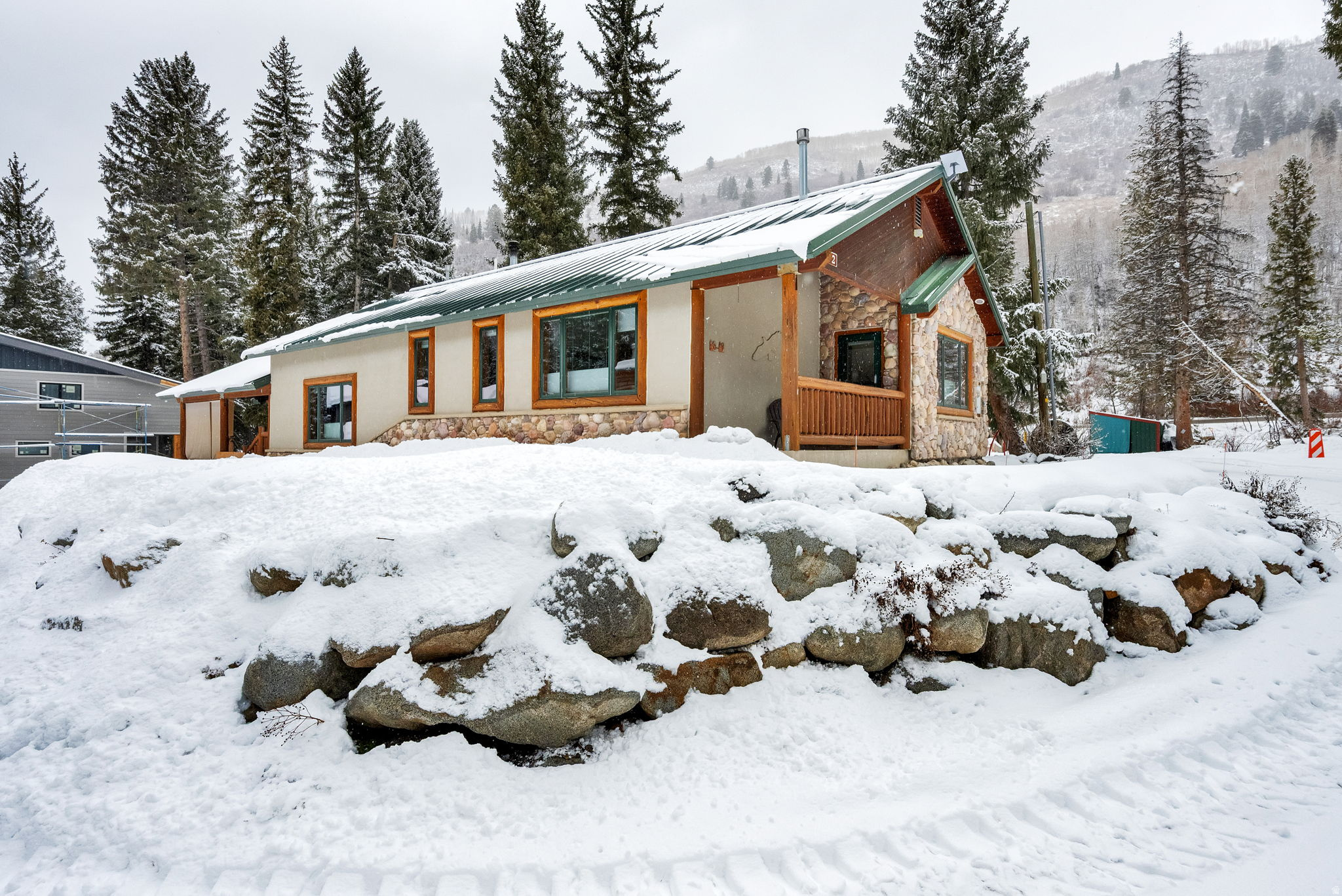 Luxury Mountain Sanctuary at the Gateway to Endless Adventure  Welcome to an exceptional mountain retreat where refined comfort meets year-round adventure. Perfectly positioned just one mile from world-class skiing at Brighton and Solitude, this stunning cabin offers instant access to hiking, backcountry skiing, and mountain biking directly from your front door-no trailhead drives required.  Crafted with modern, high-quality construction, this 4-bedroom, 3-bath residence spans over 3,400 square feet and is designed for both effortless entertaining and serene mountain living. The chef's kitchen is beautifully appointed with custom Alder cabinetry and granite countertops, seamlessly blending rustic warmth with upscale finishes. Recent updates include luxuriously remodeled bathrooms, fresh designer paint, plush new carpet, and gleaming Australian Cypress hardwood floors throughout.  The home is fully smart-wired for centralized entertainment and surround sound, creating the perfect aprs-ski atmosphere or cinematic retreat after a long day outdoors. Practical luxury abounds with generous storage, ideal for all your gear-from skis and bikes to paddleboards and snowshoes.  Enjoy true peace of mind with a year-round, inexhaustible natural water source on the property and a dedicated backup generator, ensuring uninterrupted comfort in every season. Winter access is remarkably easy via a mostly flat road that is consistently plowed, making this a rare, hassle-free canyon residence.  Despite its secluded alpine setting, you're just 25 minutes from shopping and dining, 50 minutes from Salt Lake International Airport, and in the summer, a scenic 20-minute drive to Park City over Guardsman's Pass.  Priced well below comparable properties, this turnkey mountain sanctuary delivers luxury, adventure, and value in one extraordinary package. Homes like this-where high-end living meets immediate access to the outdoors-rarely come available. Must see to fully appreciate.