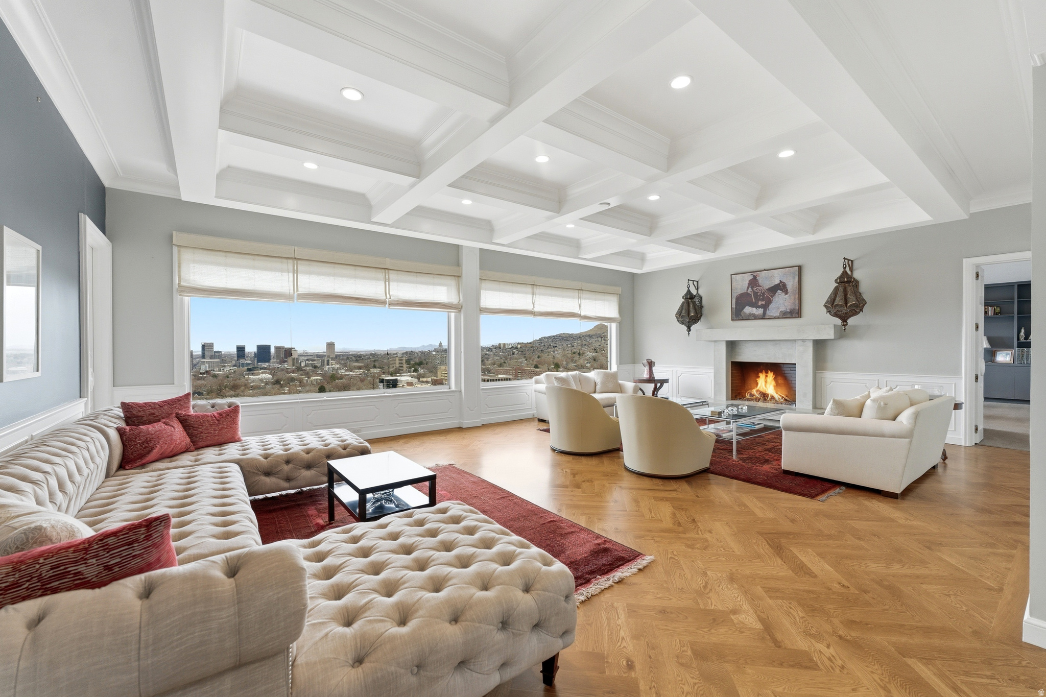 Wasatch Towers Penthouse No. 1001 commands the entire top floor of this boutique, self-managed building of only 23 residences. Step off the private elevator into 5,486 luxurious square feet, two oversized terraces, 360-degree views, and the kind of privacy that only a full-floor penthouse can offer.   The layout is thoughtful with multiple gathering areas, outdoor living space, and two fireplaces to keep things warm and grounded. The intentionally designed and well-appointed kitchen features Thermador appliances, sleek modern cabinetry, two dishwashers, and beautiful finishes. Expansive windows wrap every living space in natural light, and with the unit occupying the full floor, the views are truly panoramic- downtown Salt Lake City, the University of Utah, and the Wasatch Range filling the horizon of one of Utah's most dramatic urban backdrops. Two generous suites anchor opposite ends of the home, each with an ensuite bath and walk-in closet. A third bedroom sits tucked away for guests, the den adds flexibility, convenient laundry room, and three baths plus a powder room round out the floorplan. This residence is the only in the building with two spots in a dedicated private surface-level garage in addition to the standard spot in the communal garage.   Wasatch Towers is well-run and tight-knit, with owners who care. A new elevator was installed in 2023, the roof has been replaced, and a beautifully reimagined mid-century garden was completed in 2024. Walk to the University of Utah quad. Minutes from Research Park, Red Butte Gardens, and endless trails. Downtown Salt Lake's dining and culture is right there, and world-class skiing is just 30 minutes out.