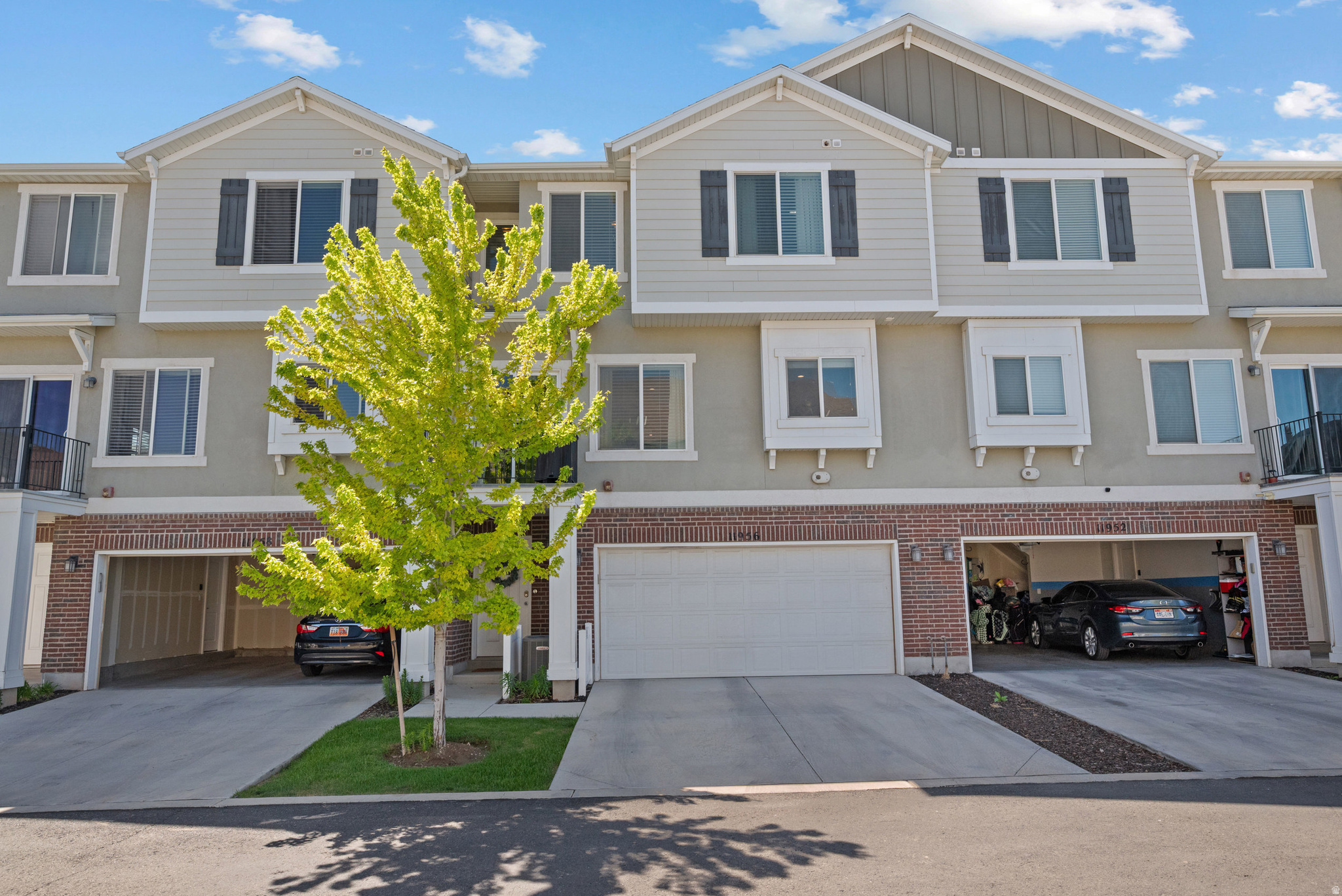 3.375% ASSUMABLE LOAN!! This townhome, in the heart of Herriman, has been well maintained and comes with smart features. Smart switches throughout the home allow you to dim the lights or turn them on and off via your phone, Alexa or Google. The front door has keyless entry and a video doorbell. The insulated garage door is controlled via an app, as well. You'll also find a custom brick wall in the living room, custom wood wall in the master bedroom, and a custom penny round backsplash in the kitchen. The whole home is hooked up to a Brita water filtration system. Also, enjoy the ease of cooking with an induction cooktop and gas line to the balcony for 'grill' nights. Enjoy peace and quiet with extra insulation in between the living room and bedroom levels keeping the noise where it belongs. AND GET THIS!! The owners are willing to leave all the furniture and appliances (except the grill, washer, dryer, bookshelves, mattress and the TV's) with a full price offer. Their loan is also assumable with a 3.375% interest rate (Note: assuming the loan could take 6-8 weeks). This will keep your payment very affordable.