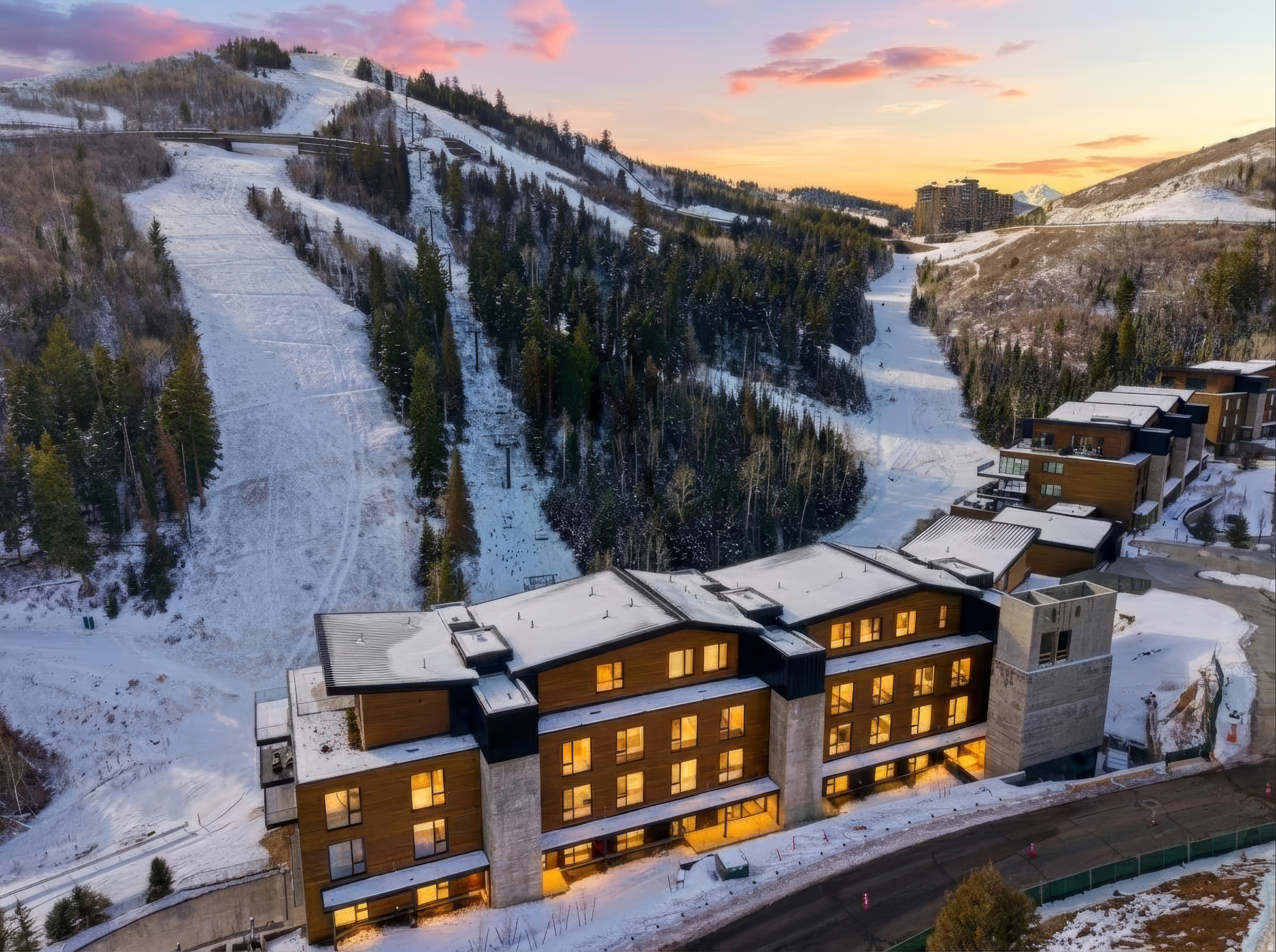 Located in the exclusive gated community of Deer Crest, The Helen at Founders Place offers true ski-in/ski-out access directly across from the Mountaineer Express Lift at Deer Valley. Enjoy panoramic views of the mountain, Jordanelle Reservoir, and Uinta Mountains from this exceptional residence.  This 3-bedroom, 3.5-bathroom condominium with a media room and office combines contemporary mountain design with the comfort of home. The open-concept great room features floor-to-ceiling windows, a steam fireplace, and sliding glass doors leading to a spacious wraparound deck for seamless indoor/outdoor living.  The chef's kitchen includes a large pantry, high-end finishes, and generous workspace. The primary suite offers a luxurious bath and walk-in closet with stunning lake and mountain views. Each bedroom features a private en-suite bath. Additional highlights include direct elevator access, laundry room with full-size washer and dryer, the large media room, and an end location allowing for extra natural light.  Owners enjoy exclusive access to The Polly, Founders Place's private amenity center featuring a fitness center, outdoor pool and hot tub, ski lounge, cafe, kids' and teen lounges, and golf simulators.  Surrounded by hundreds of acres of open space, hiking and biking trails, and year-round outdoor recreation, Founders Place delivers the best of Deer Valley luxury living in every season.