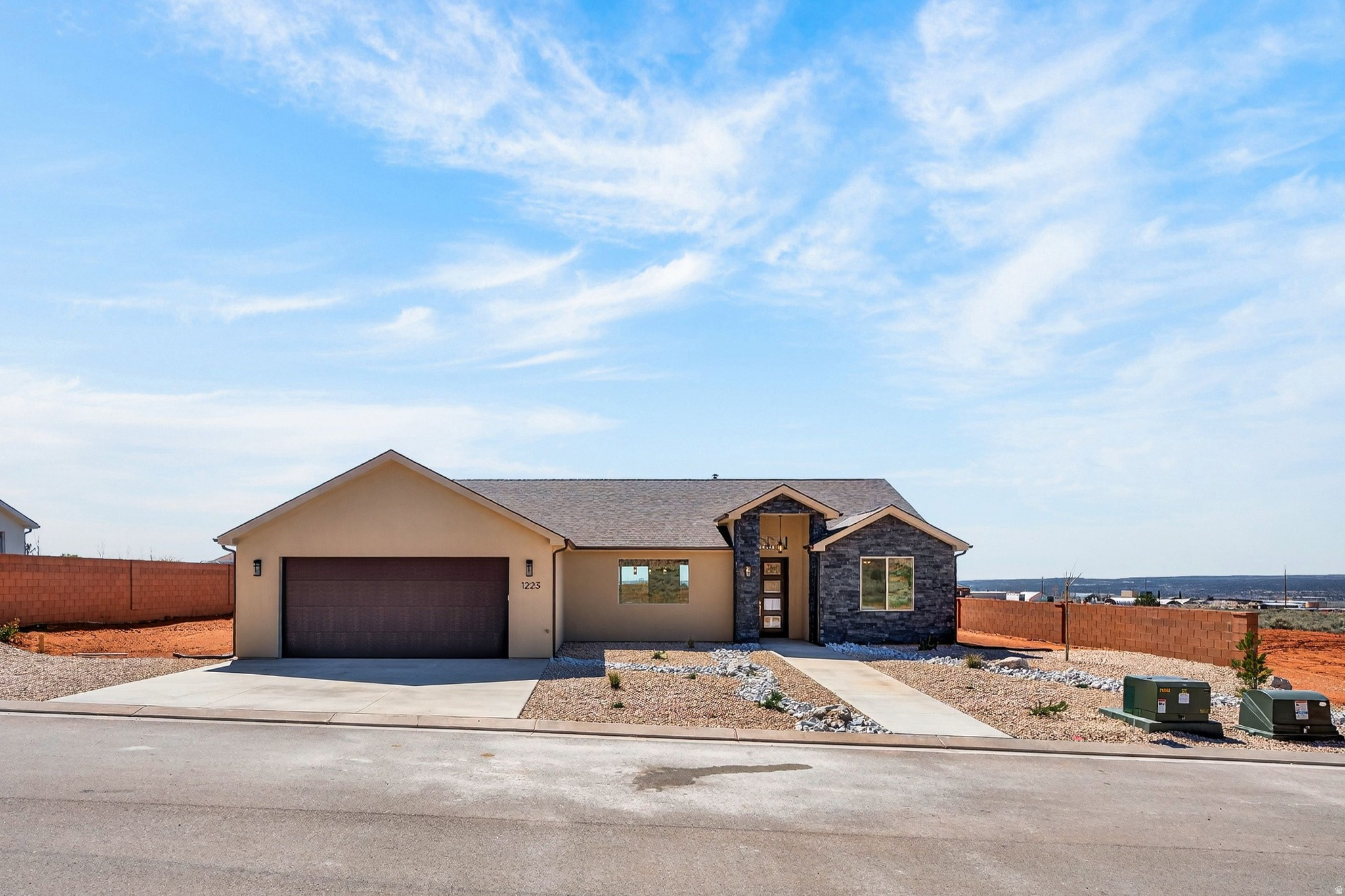 **Seller financing is an option with 20% down**Introducing a stunning new home in the prestigious Heights Subdivision! This thoughtfully designed 3-bedroom, 2-bathroom home offers breathtaking red rock mountain views, a spacious 2-car garage, and RV parking for all your toys. The gourmet kitchen will include custom white cabinetry, quartz countertops, and stainless-steel oven range and dishwasher, perfect for cooking, baking, and entertaining. Upgraded lighting fixtures highlight the abundant natural light, while durable LVP flooring flows through the main living areas and cozy carpet creates comfort in the bedrooms. The vaulted primary suite is a true retreat, with windows framing gorgeous views and a luxurious ensuite featuring dual vanities, a designer shower, and a relaxing soaker tub. Outside, the partially landscaped yard with fencing provides a private oasis for family, pets, and gatherings. Nestled at a 5,000 ft elevation, this home is surrounded by stunning terrain and a favorable climate. Located just off the edge of town, you'll be close to riding and hiking trails, 5 National Parks, Sand Dunes, and within a short drive to Lake Powell (90 minutes), the Grand Canyon (60 minutes), Zion (45 minutes), Kanab (30 minutes), and St. George (40 minutes). Make this extraordinary home yours today.