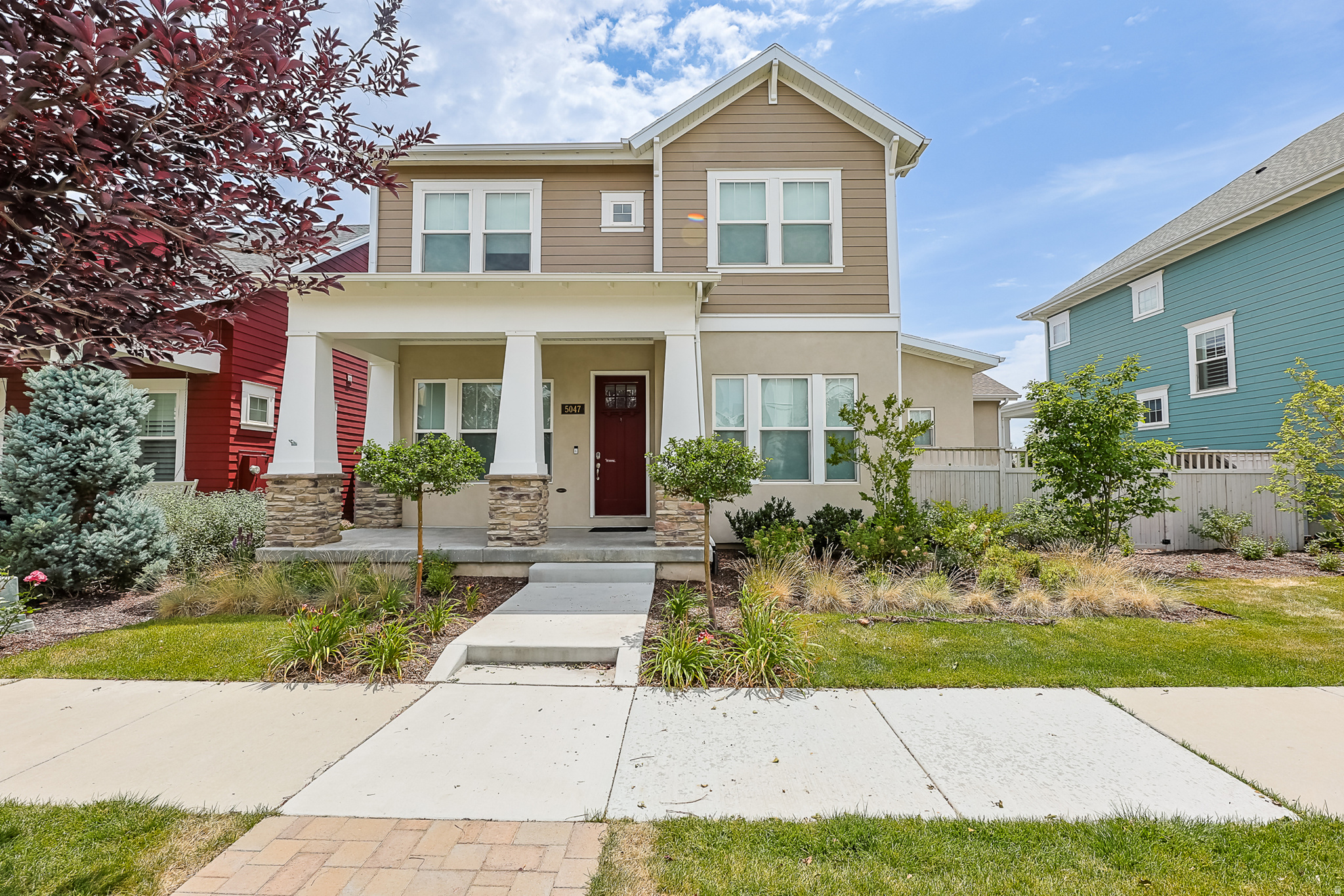 Welcome to this beautifully updated 5-bedroom, 4-bathroom home in the heart of Daybreak, offering over 3,400 sq. ft. of thoughtfully designed living space just down the street from Oquirrh Lake. The open-concept floor plan is filled with natural light and features a spacious great room with a custom built-in entertainment center, a stylish kitchen with stainless steel appliances, and generous dining and living areas perfect for everyday living and entertaining. Upstairs, the oversized primary suite offers a spa-like bathroom and an impressive closet. The recently finished basement adds even more functional space with a dedicated fitness room featuring glass doors and mirrors that can also double as an incredible golf simulator space. All carpet has been replaced within the last year, giving the home a fresh, move-in-ready feel. The garage includes an estimated 600 square feet of mezzanine storage, EV charging, and an additional refrigerator. Outside, enjoy a fully fenced backyard with a spacious patio, ideal for relaxing or hosting guests. Located in the award-winning Daybreak community, you'll enjoy access to Oquirrh Lake, five community pools, over 50 miles of trails, parks, pickleball and basketball courts, community gardens, a fitness center, weekly summer farmers markets and concerts, shopping, dining, top-rated schools, and included fiber internet. This is the perfect opportunity to enjoy one of Utah's most sought-after communities. Square footage figures are provided as a courtesy estimate only and were obtained from a previous listing. Buyer is advised to obtain an independent measurement.