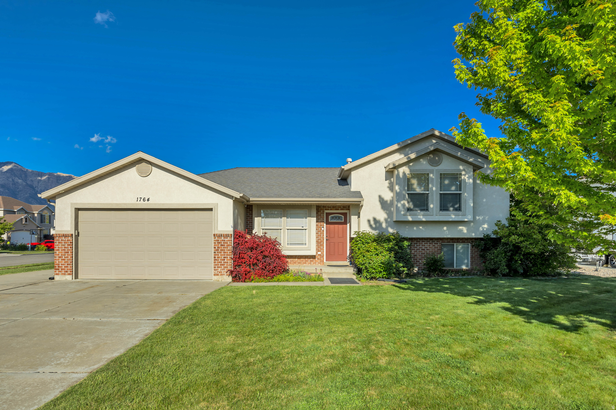 Beautiful tri-level home located in desirable North Ogden neighborhood! Enjoy vaulted ceilings, a cozy fireplace, and a comfortable open living and kitchen area perfect for everyday living and entertaining. The large fully fenced yard offers plenty of space to relax, play, or garden, plus an extra-large RV pad and tons of storage. Humidistat installed. Take in stunning mountain views from the patio and enjoy all this home has to offer!