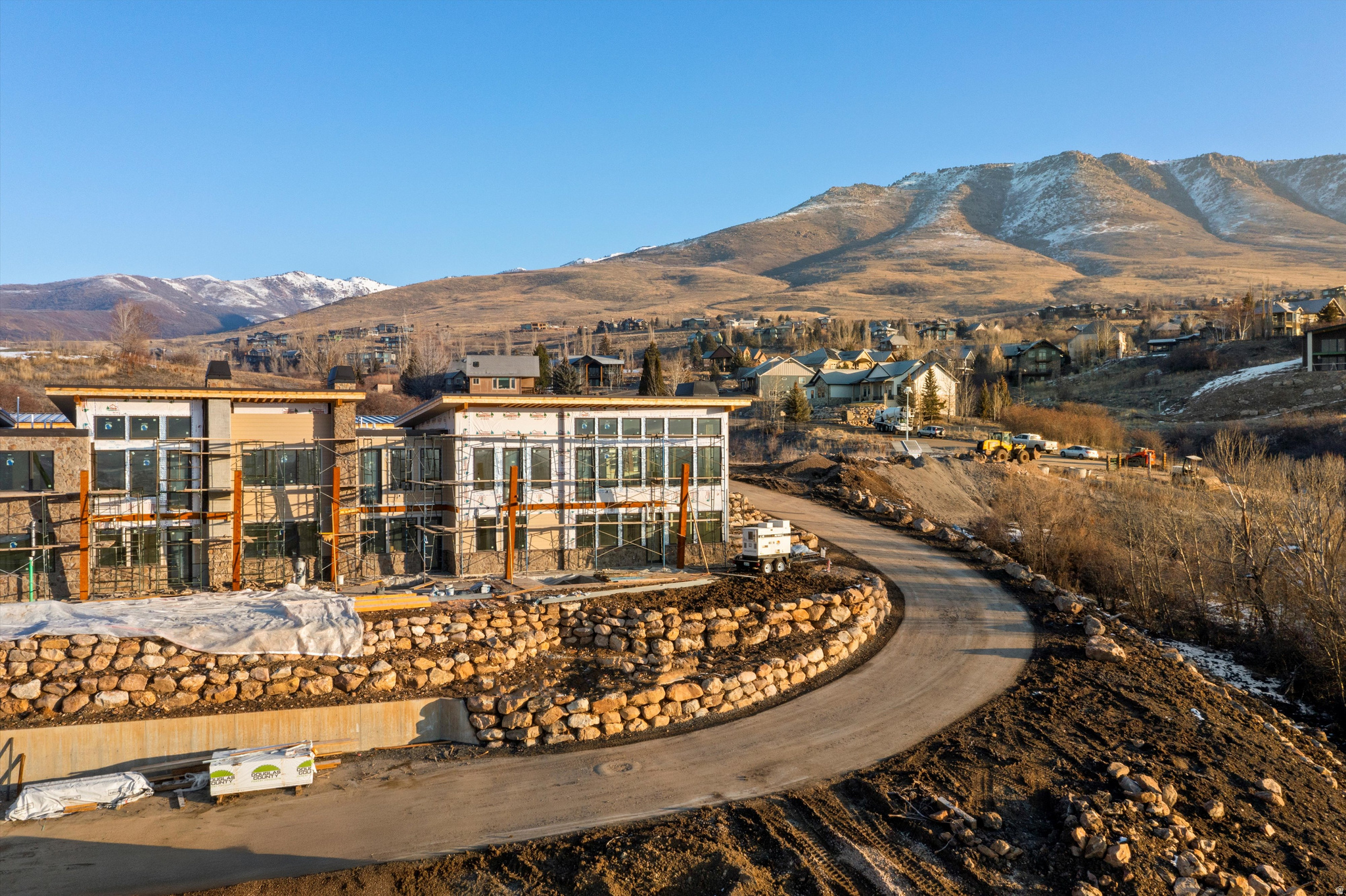Experience elevated mountain living in The Ridge at Wolf Creek Resort in the heart of Eden, where this Cobabe Plan townhome offers 2,356 square feet with three bedrooms and three and a half baths. Well suited as a vacation rental investment, a secondary mountain getaway, or a comfortable full-time residence. The layout is designed for comfort and functionality, featuring warm mountain finishes like knotty alder trim, baseboards, and doors, along with stone fireplaces that anchor the living spaces. An open floor plan flows naturally to a private elevated deck that captures the surrounding mountain setting. While radiant heat on the lower level adds efficiency and winter comfort. A one-car garage provides convenient storage for outdoor gear and recreational equipment. The location places you just eight miles from Powder Mountain and minutes from Snowbasin and Nordic Valley, with Pineview Reservoir less than ten minutes away for boating and paddleboarding, plus easy access to nearby trails and snowmobiling terrain. As part of the closeout phase of The Ridge townhomes, owners enjoy a completed community pool and hot tub with panoramic views, along with the public Wolf Creek golf course directly across the street, creating a flexible mountain property that supports both lifestyle and long-term value. Square footage figures are provided as a courtesy estimate only. Buyer is advised to obtain an independent measurement.