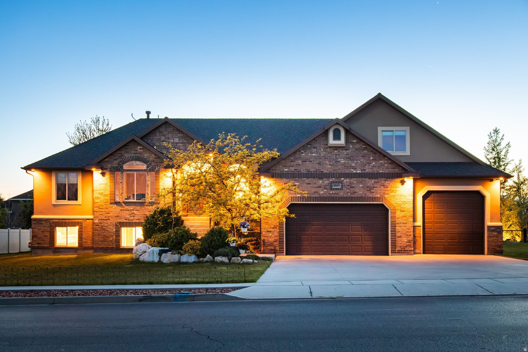 Meticulously maintained, move-in ready Spacious Luxury Rambler with Extra Parcel & Stunning Mountain Views! Get the best of both worlds-community and peaceful country living. Located just 20 minutes from HAFB, this beautifully designed 6-bedroom, 3.5-bath custom home was built in 2012. Situated on a fully landscaped and treed 0.45-acre lot, this property also includes an additional 0.41-acre adjoining parcel- with cabin onsite offering incredible potential.  Inside, you'll find a thoughtfully designed open layout with expansive living spaces, abundant natural light, and a custom kitchen featuring upgraded cabinetry with pull-out shelving. The home is equipped with both gas and electric hookups for the range and dryer, and the fully finished ground level walk-out basement,  plumbed and wired for a second kitchen is ideal for multi-generational living or added flexibility. A second ensuite in the basement adds even more versatility. Designed for modern living, this home is a tech enthusiast's dream, featuring a dedicated communication room, security cameras throughout, wired Ethernet in every room as well as wired Wi-Fi access points, and Crestron automation including whole home audio. The main-level primary suite offers a private retreat, while additional bedrooms provide ample space for family, guests, or home office needs. A separate media room adds a perfect space for entertainment. Step outside to your own private outdoor retreat featuring a spacious deck with sweeping mountain views, mature landscaping with nighttime landscape lighting, a privacy hedge, and a charming picnic area. Enjoy fresh Italian plums, and drip-irrigated raspberry and Goji berries. The included adjoining parcel features a cabin/shed with a full height loft, power, wired internet and Wi-Fi, allowing for additional usable space. The dedicated fire pit area is perfect for gatherings and outdoor entertaining.  The oversize garage offers exceptional height, depth and width, making it ideal for large vehicles, storage or workshop use.  This is the only home in the development with a double lot, and with NO HOA, you'll enjoy both freedom and space. A rare opportunity to own a  versatile, private, and beautifully upgraded property with room to grow.  Included second parcel (Tax ID 19-339-0024)  annual taxes $89. Make sure to view the video to get a sense of this truly unique property in the "Tours" section. Don't miss your chance to make this exceptional property yours-schedule your showing today!
