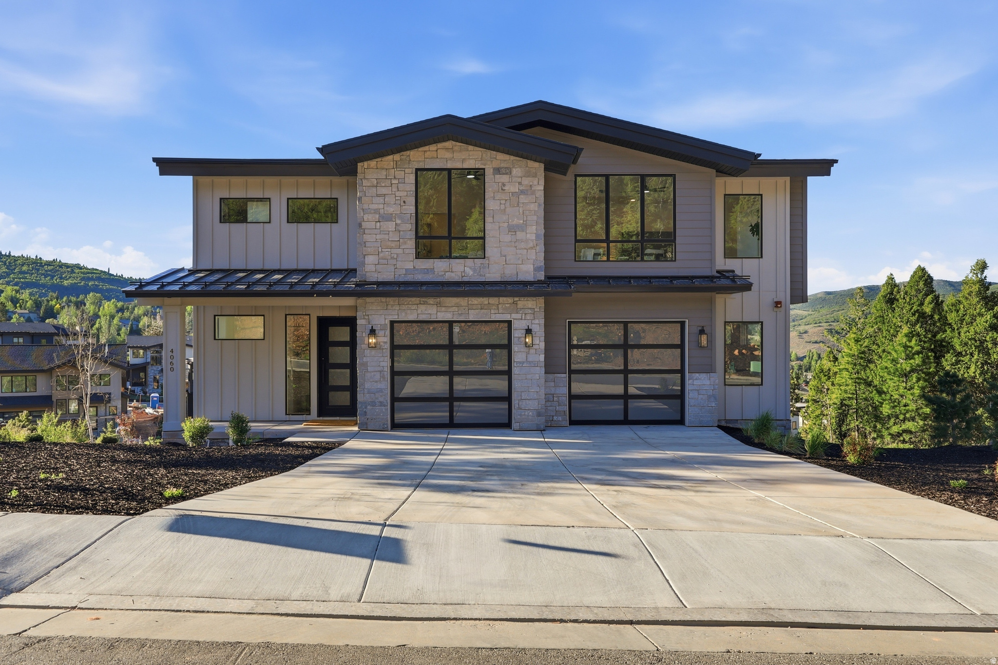 Experience the perfect blend of contemporary design, mountain serenity, and exceptional convenience in this newly constructed residence located within Discovery Ridge. Offering 4,439 square feet of thoughtfully designed living space, this home features 4 bedrooms, 5 bathrooms, and a functional floor plan crafted for both everyday living and effortless entertaining. Expansive windows fill the home with natural light while showcasing the surrounding mountain landscape. The open-concept design creates a seamless flow between the living, dining, and kitchen spaces, providing an inviting setting for gathering with family and friends. A pre-wired theater room offers the opportunity to create a dedicated media and entertainment space, while quality finishes and modern craftsmanship are evident throughout the home. Set among protected open space and miles of maintained trails, Discovery Ridge offers a unique connection to the outdoors with immediate access to hiking, biking, and year-round recreation. At the same time, residents enjoy convenient proximity to Historic Main Street, Park City Mountain, Deer Valley, Woodward Park City, and Salt Lake City International Airport, making it easy to enjoy both mountain adventure and everyday accessibility.