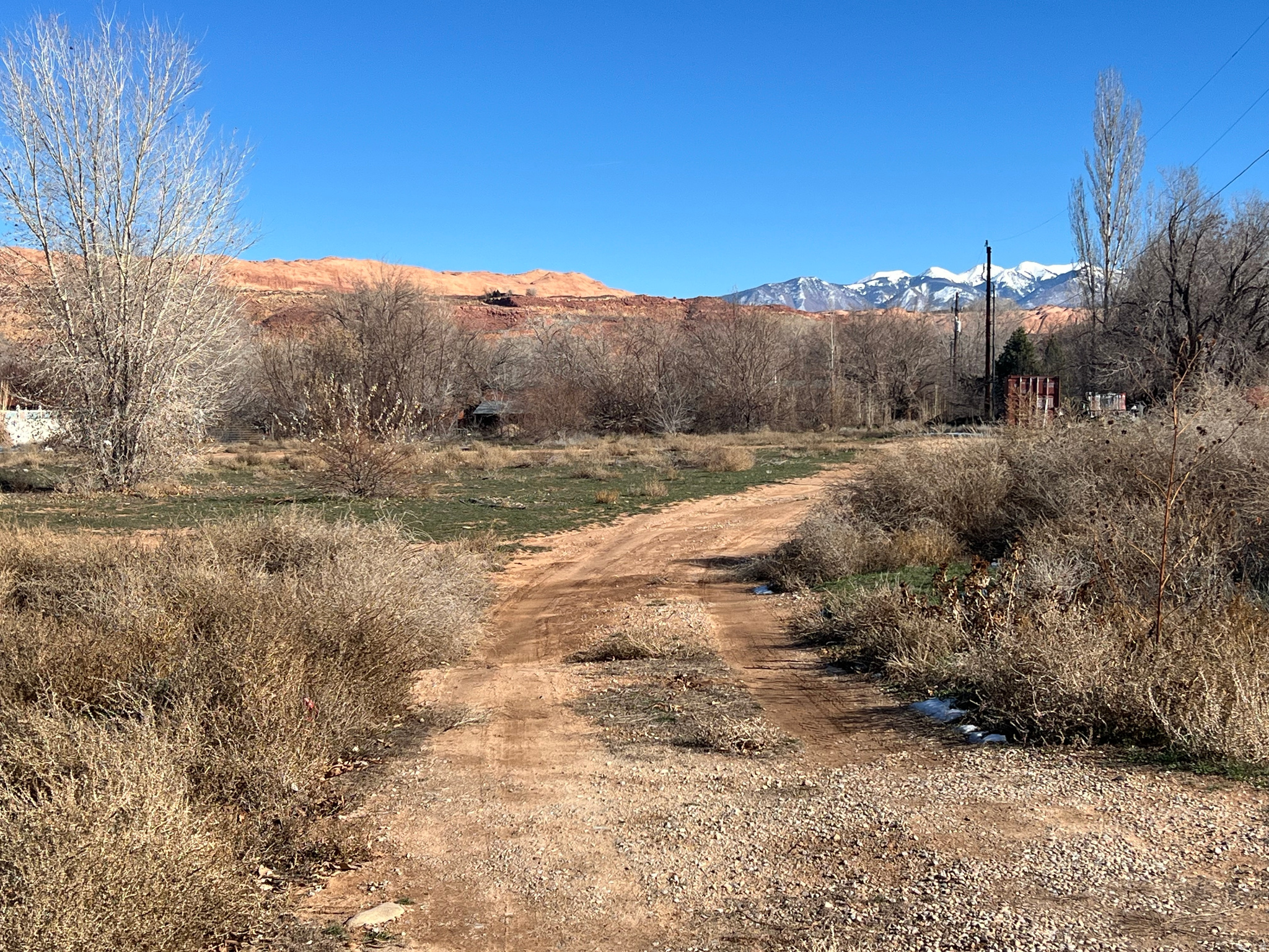Over two acres of downtown Moab land ready for development into residential homes, duplexes, or a multi-unit. Mountain and rim views. Utilities located on 400 E or Kiva Dr.  The parcel stretches 628 feet from 400 E across from the high school to the boundary with Mulberry Lane subdivision. Excellent potential for a visionary developer.
