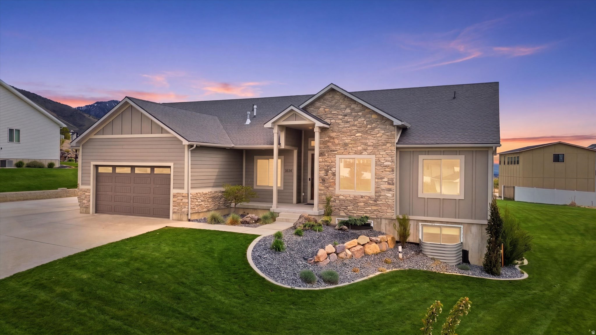 This immaculate east bench rambler sits on a beautifully landscaped .44-acre lot and offers the perfect blend of space, function, and views. The open-concept floor plan creates a bright, seamless flow throughout the home, ideal for both everyday living and entertaining. Meticulously maintained and exceptionally clean, this home shows true pride of ownership at every turn. The oversized, extra-deep garage includes a convenient rear door, providing easy access to the backyard-perfect for projects, storage, or outdoor living. Downstairs, a dedicated exercise room offers flexibility and could easily be converted into an additional bedroom to fit your needs. With high-speed Ethernet wiring throughout, this home is fully equipped for modern living. A rare combination of location, condition, and features-this is one you don't want to miss.
