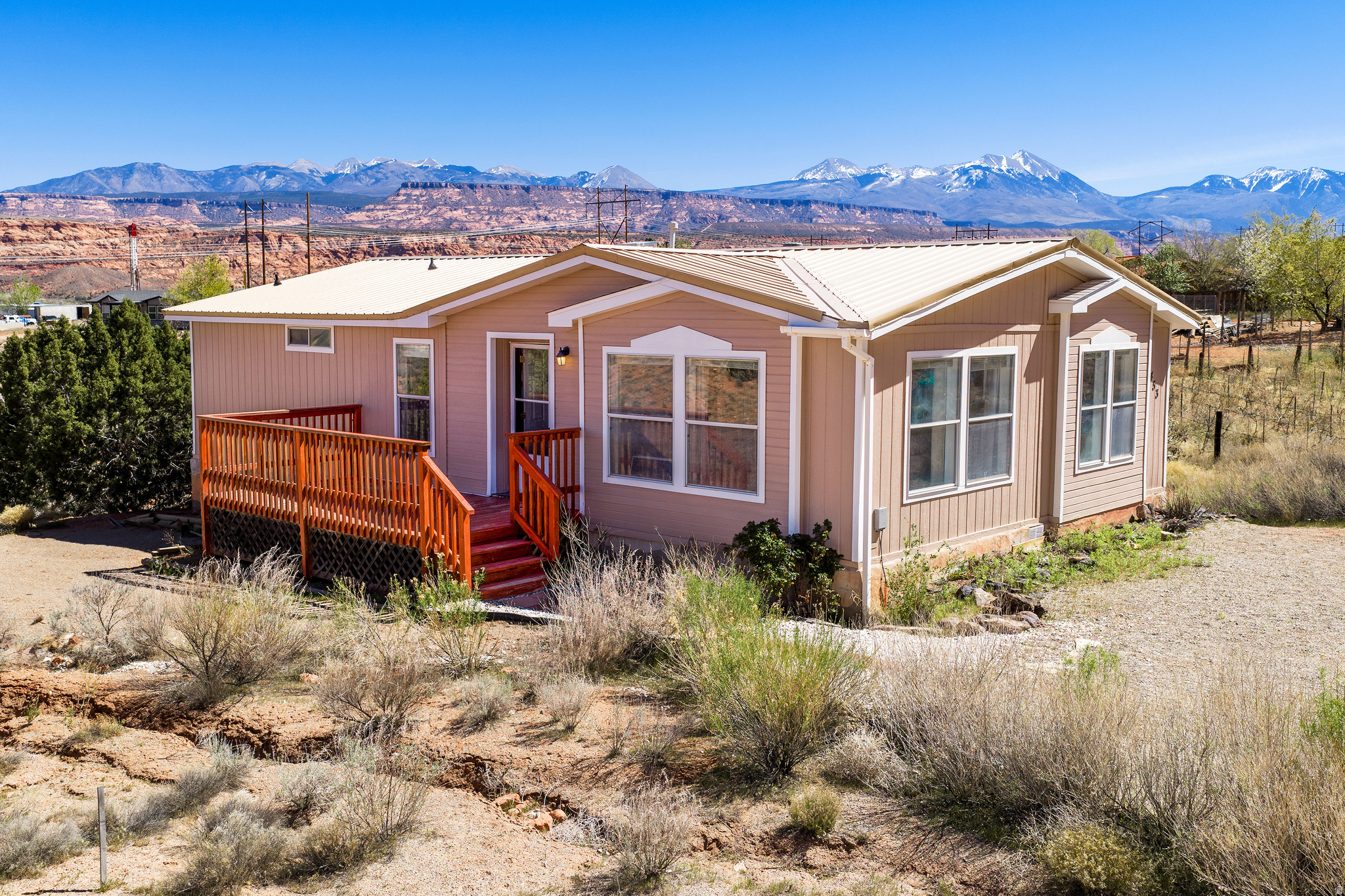 Quiet, peaceful location - close to town - with amazing views of the La Sal Mountains and the Red Rocks.  Perched at the end of a cul-de-sac, this well maintained 3 bedroom, 2 bath home offers newer appliances, solid surface countertops, newer HVAC system, new exterior paint, and a fully remodeled primary bathroom with walk in shower and double sinks.   The large back covered deck is the perfect place to relax and enjoy a meal with some of the best views Moab has to offer. Ready to move in and enjoy...you can't ask for more!