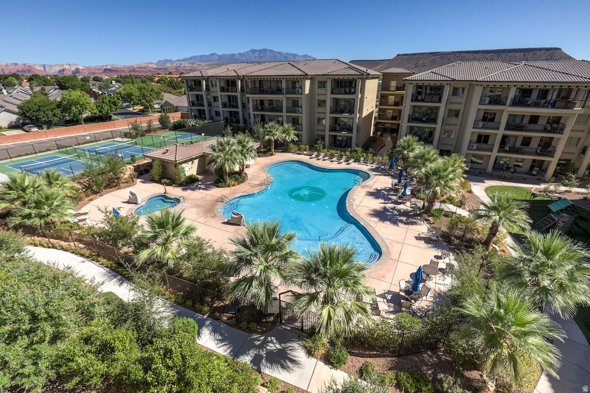 Gorgeous Luxury Main Floor CONDO in ESTANCIA RESORT!  NIGHTLY RENTAL SLEEPS 10 PEOPLE!!!  Rare 2 Bdrm,2 Bath Unit, Built 2015, Wide Open Floor-plan on One-Level,  Large Family Gathering areas in the Livingroom, Kitchen, or Diningroom, Covered Parking Right in Front, Upgraded Interior, Comes Fully Decorated w/ Beautiful Living-room/ Dining-room/ Bedroom Furniture, Refrigerator, Washer & Dryer All Included.  This Unit has been Easy to Nightly Rent because it is all on one floor Unit and Amazing Amenities.  AMENITIES: Massive Pool, Extra Large Built in Hot Tub, Playground, Pickleball & Basketball Court.  ATV & Mountain Bike Trails Minutes Away, Lots of Extra Parking.  Elite Space for Families to Come Relax or be an Adventurist on the Weekends or All Week!
