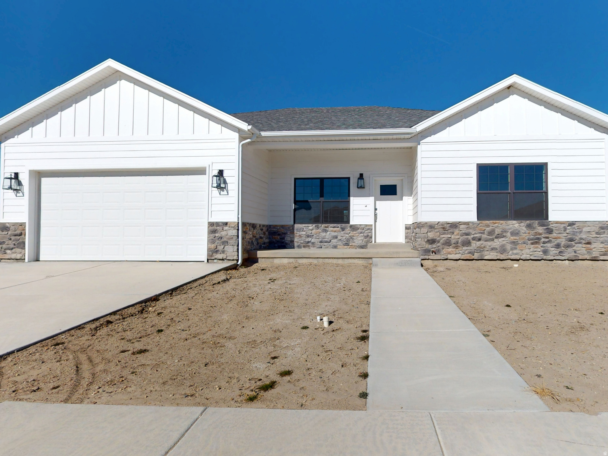 This modern new-construction home combines traditional charm with contemporary design, featuring a full basement and sleek white, gray, and chrome finishes. The interior offers three bedrooms, two bathrooms with double sinks, and a two-car garage. The chef's kitchen includes all-new G.E. stainless steel appliances, Corian countertops, and a farmhouse sink, along with a pantry, closet organizers, and a dedicated cabinet for the kitchen wastebasket. The master bedroom and dining room both open to a spacious back patio, perfect for outdoor living and entertaining. Additional features include plumbing for a water softener and garage outlets ready for electric vehicle charging, making this home stylish, functional, and future-ready.