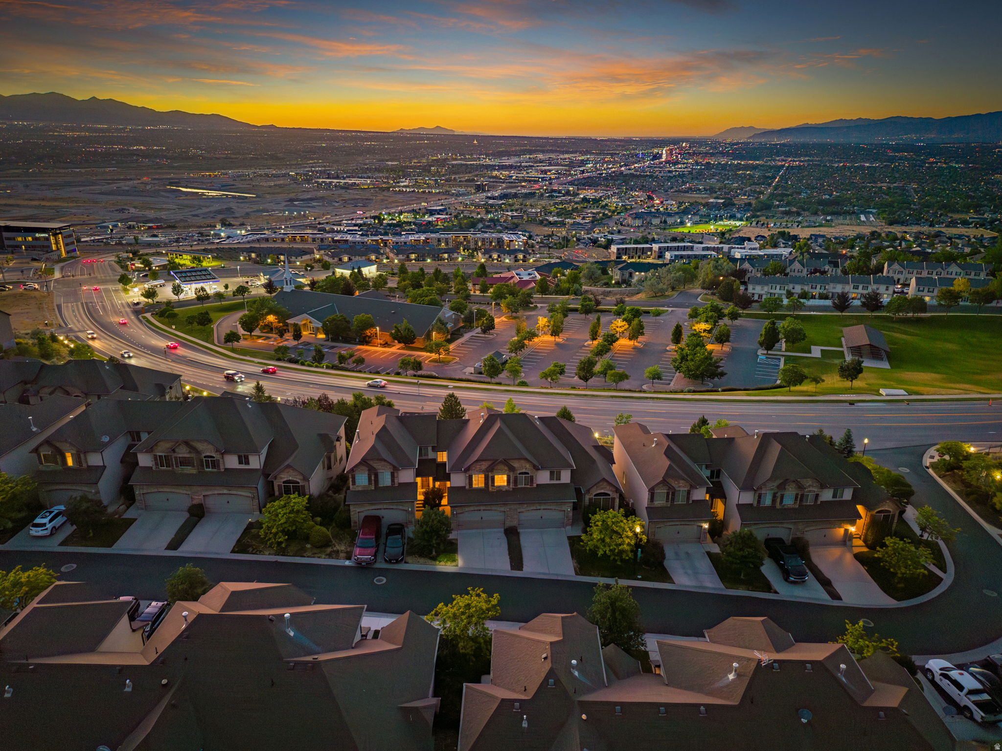 Wake up to sweeping views of the entire Salt Lake Valley from this Draper townhome in the highly sought-after Traverse Chateaux community. Perfectly positioned to capture breathtaking mountain and valley views, this home offers an unbeatable combination of location, convenience, and low-maintenance living. Fresh paint and updated lighting throughout provide a clean, welcoming feel, while large windows bring in natural light and frame expansive views of the Salt Lake Valley. The main living area and deck offer a unique vantage point to enjoy fireworks displays across the valley during July celebrations. The finished walkout basement features a wet bar and flexible living space ideal for entertaining, working from home, or accommodating guests. Enjoy the ease of HOA-maintained living with landscaping, snow removal, exterior maintenance, water, sewer, and trash all included. Located just minutes from I-15, Silicon Slopes, and The Point, Draper's transformative mixed-use development that is being built, you'll have convenient access to Utah's growing tech corridor, future dining and retail destinations, parks, trails, and expanding transit options. Top-rated schools in the Canyon's School District and world-class outdoor recreation complete the appeal. With incredible views, a functional floor plan, and an opportunity to add your own style and updates over time, this home offers exceptional value in one of Draper's most established communities.   Square footage figures are provided as a courtesy estimate only and were obtained from tax records.  Buyer is advised to obtain an independent measurement.
