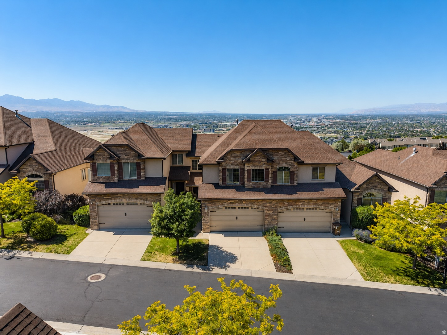Wake up to sweeping views of the entire Salt Lake Valley from this Draper townhome in the highly sought-after Traverse Chateaux community. Perfectly positioned to capture breathtaking mountain and valley views, this home offers an unbeatable combination of location, convenience, and low-maintenance living. Fresh paint and updated lighting throughout provide a clean, welcoming feel, while large windows bring in natural light and frame expansive views of the Salt Lake Valley. The main living area and deck offer a unique vantage point to enjoy fireworks displays across the valley during July celebrations. The finished walkout basement features a wet bar and flexible living space ideal for entertaining, working from home, or accommodating guests. Enjoy the ease of HOA-maintained living with landscaping, snow removal, exterior maintenance, water, sewer, and trash all included. Located just minutes from I-15, Silicon Slopes, and The Point, Draper's transformative mixed-use development that is being built, you'll have convenient access to Utah's growing tech corridor, future dining and retail destinations, parks, trails, and expanding transit options. Top-rated schools in the Canyon's School District and world-class outdoor recreation complete the appeal. With incredible views, a functional floor plan, and an opportunity to add your own style and updates over time, this home offers exceptional value in one of Draper's most established communities.   Square footage figures are provided as a courtesy estimate only and were obtained from tax records.  Buyer is advised to obtain an independent measurement.