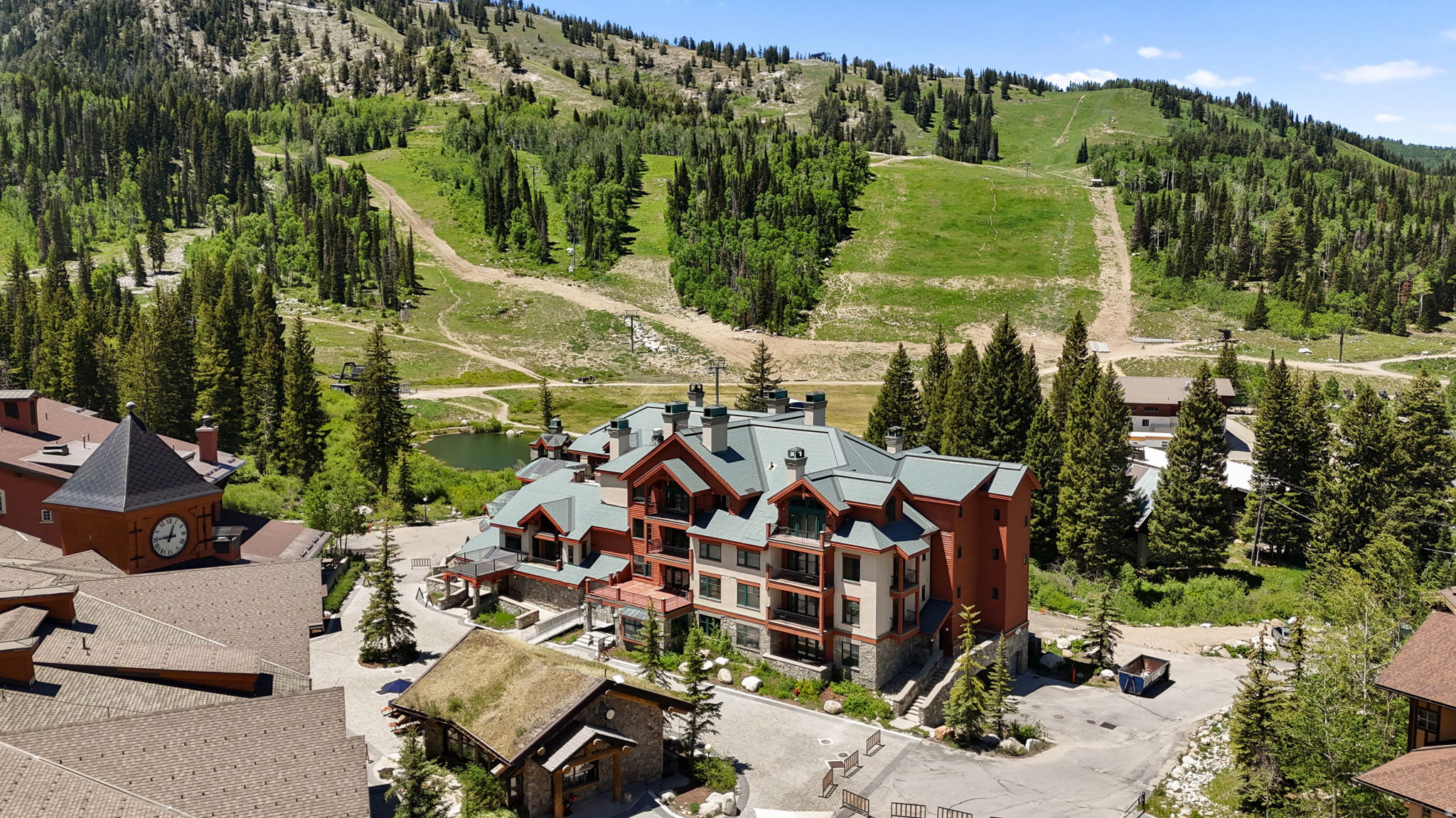 Rare availability in one of Solitude's most coveted and intimate condominium buildings. Creekside is an exclusive 18-unit complex - that's it, just 18 - and Unit 103 sits on the creek-facing side, where the sound of moving water and aspen-lined views are yours every single day. Step out onto your own private covered patio and you're sitting right on top of it all - morning coffee, aprs drinks, or just listening to the creek go by. The location alone is hard to beat. A short walk to the lifts in winter means you're on snow fast, every time. Come summer, world-class hiking, mountain biking, lift-served trails, and one of Utah's most scenic disc golf courses are practically at your doorstep. Four full seasons of resort living, all from the same front door. The building itself is stacked with amenities that most resorts can't touch. Your own private rooftop hot tub deck, a ski locker in the building locker room, cage storage in the heated garage, and one designated parking stall in the Creekside-only underground garage. That's the everyday stuff. Then add Club Solitude access - a full resort amenity club with a pool and waterslide, two hot tubs, a fitness center, men's and women's locker rooms each with a sauna, a private movie theatre, a kids' game room, and a pool table. Whether you're entertaining guests or just unwinding after a long day on the mountain, it's all right there. Add it all together - the creek views, the private covered patio, the ski proximity, the intimate 18-unit building, the rooftop hot tub, the Club Solitude access - and you have something truly rare in Big Cottonwood Canyon. This is Solitude at its best.