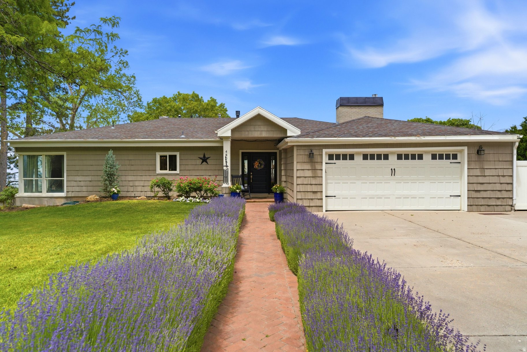A lavender lined walkway welcomes you to your dream home nestled at the base of beautiful Mt. Olympus with expansive unobstructed mountain and valley views! See valley wide firework shows on July 4th. Enjoy quick access to freeways, canyons, and nature trails! Walk out of your basement to a picturesque secluded party yard, complete with a covered patio and an adult rated swing set, slide and zip line. Gardening more your interest? Enjoy 4 fantastic garden boxes. Inside find 3 beautifully remodeled baths and a super functional updated kitchen with stainless appliances, granite counter tops, bar dining, and a gas stove. Relax and enjoy sunsets from your private primary suite deck! Tickle the ivories while enjoying the view from your family room windows. Every window in the house boasts a gorgeous view. No need to worry about snow with the flat street level driveway, a real bonus in the upper Cove!!