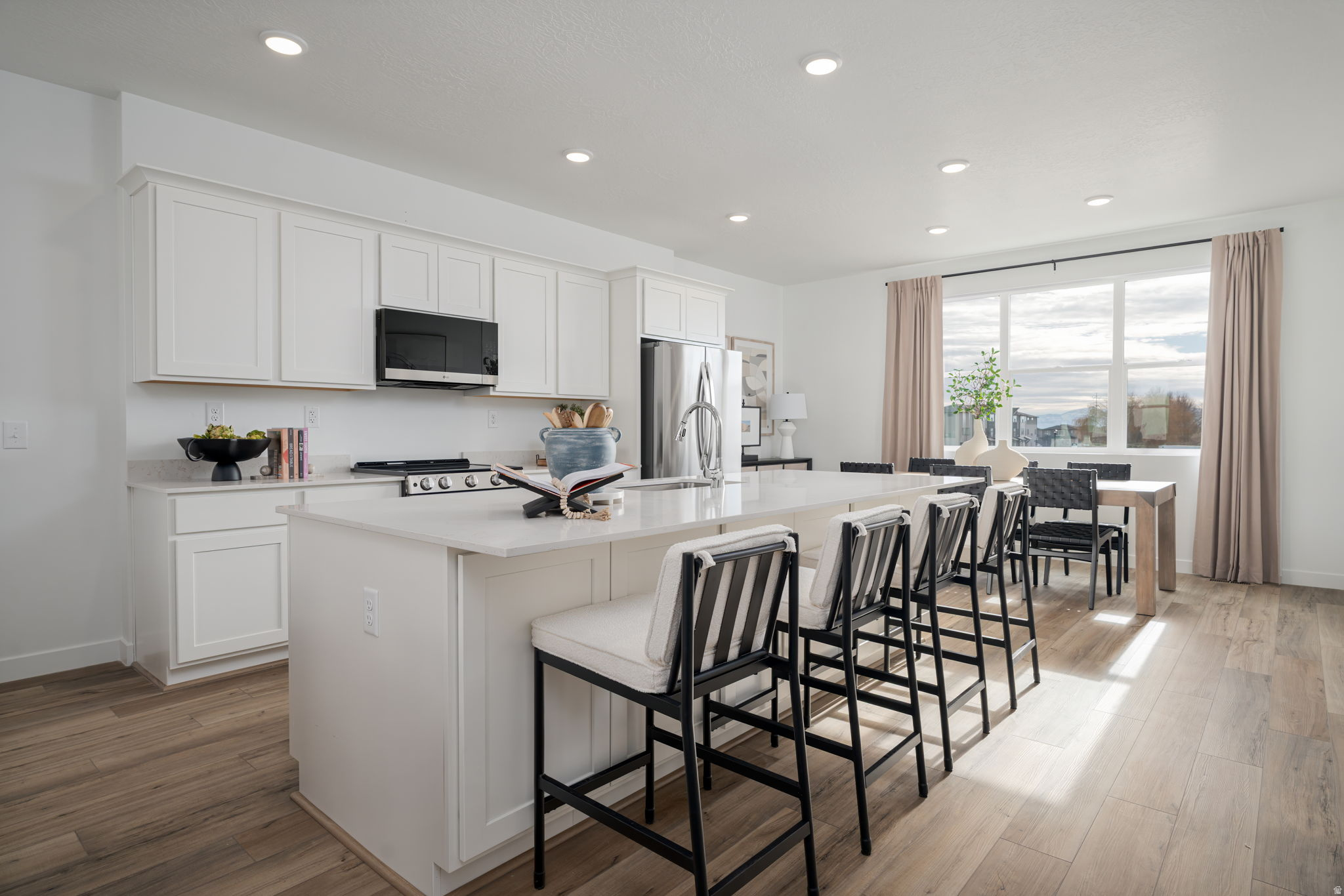 Homesite #276 - The Keansburg offers a smart layout with stylish finishes throughout. This 4-bedroom, 3.5-bath home features 1,986 sq. ft. of thoughtfully designed living space, perfect for both everyday living and entertaining.  The main level showcases an open-concept design with LVP flooring throughout, creating a seamless flow between the kitchen, dining, and living areas. The kitchen features Stone Gray cabinetry, white quartz countertops, and a functional layout that balances style and efficiency.   Upstairs, the primary suite provides a comfortable retreat, while additional bedrooms offer flexibility for guests, a home office, or hobbies. With 3.5 bathrooms, this home is designed to accommodate a variety of living needs with ease. Projected completion July 2026. *Photos of model home, options & finishes may vary*