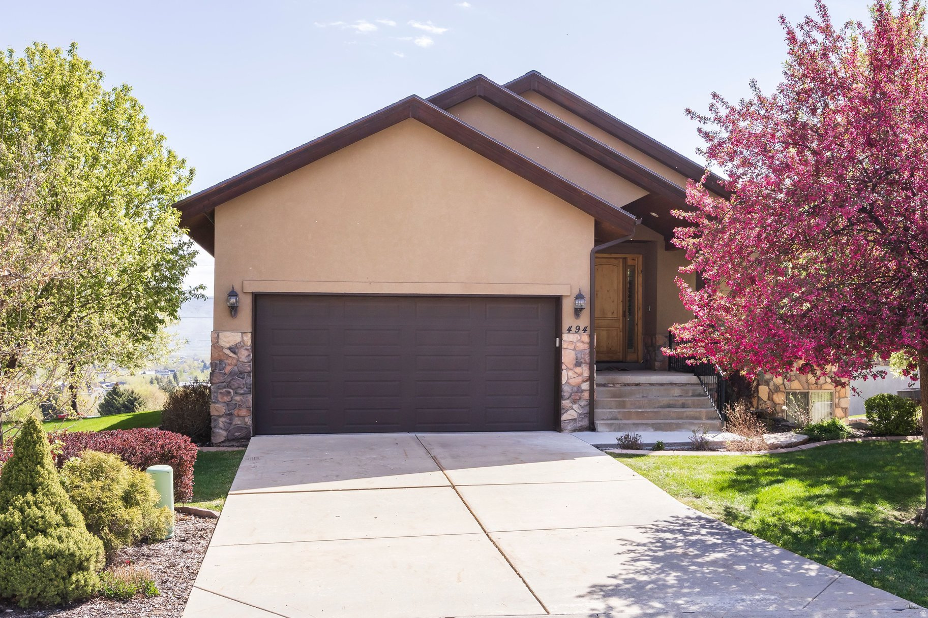 Set on one of the largest lots in Sunburst Ranch, this exceptional home offers sweeping, unobstructed views of the entire Heber Valley-enjoyed from nearly every room and across the full length of the back of the house. The newly restructured deck (2025), with elegant wrought iron railing, creates the perfect vantage point to take in the scenery, including a direct view of the iconic Homestead Crater.  This comfortable, easy-to-maintain home features 5 large bedrooms and 4 bathrooms, making it ideal for large families or gathering groups. Inside, you'll find an open floor plan, vaulted ceilings, and seamless indoor-outdoor living. Major updates include a new roof in 2024 and a radon mitigation system for added peace of mind.  Location is hard to beat-just a 5-minute walk to Homestead Golf Course, with Homestead Resort and Zermatt Resort right down the hill. You're also minutes from shopping, dining, and year-round recreation. Wasatch State Park is right around the corner, offering camping, golf, and fishing-perfect for all ages. Enjoy fabulous fly fishing on the Provo River, boating on Jordanelle Reservoir, and an extensive network of bike trails throughout the community. Plus, you're approximately 15 minutes to the ski lifts at Deer Valley's new East Village, making world-class skiing incredibly convenient.  Enjoy the charm and tradition of Midway living with Swiss Days in August and unforgettable 4th of July celebrations, kicked off by the valley-famous early morning cannon. It's also a treat to watch the beautiful deer that regularly wander through the community, adding to the peaceful mountain setting.  Whether you're relaxing on the deck, entertaining guests, or exploring the outdoors, this home delivers the best of comfort, convenience, and breathtaking views.