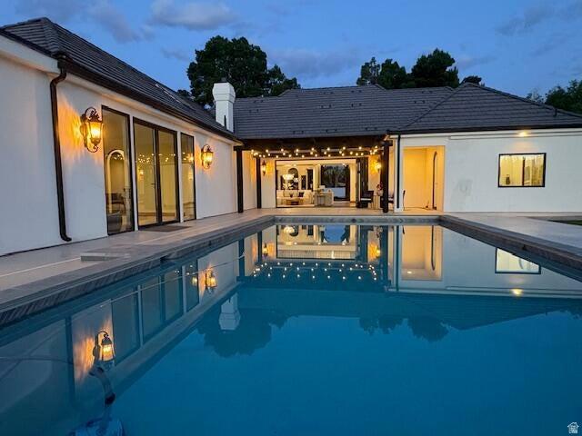 Welcome to this stunning custom Santa Barbara Style Estate with spanish flares nestled on a sprawling 1-acre lot in the Bloomington Ranchos, offering the perfect blend of traditional charm and contemporary luxury.As you approach the property, you'll be captivated by the elegant arched doorways, windows and a vibrant white exterior with black accents and roof tiles that evoke the essence of modern architecture. Step inside to discover an open-concept layout adorned with high ceilings, a bridge walkway with iron railing, natural walnut trim and large windows that flood the space with natural light. The split floor plan design provides 3 separate wings of the estate, so plenty of space for everyone. The gourmet kitchen boasts state-of-the-art appliances, custom walnut cabinetry, and a spacious island perfect for entertaining. The adjoining living area features a cozy fireplace and seamlessly connects to outdoor living spaces with a retractable iron and glass door creating the ideal setting for enjoying warm evenings under the stars. The 2nd level has a private on-suite and double loft area that serves as another gathering space. Retreat to the luxurious master suite, complete with a spa-like ensuite bathroom featuring a soaking tub, walk-in shower, and massive closet with private laundry area. The 2nd Owner Suite comes loaded with its own private entrance, laundry room and possible kitchen if desired to accommodate guests in their own Casita. The additional bedrooms are generously sized, each with unique design elements that reflect the home's character. Outside, the expansive backyard is a private oasis, a sparkling pool, sport court, RV Garage/shop with full bathroom (plumbed for kitchen and guest house), garden area, fruit trees and ample space for outdoor gatherings. The RV Garage matches home in style & color with a concrete driveway. The RV Garage is 2x6 construction and will be fully insulated with climate controls. This modern Spanish Hacienda is not just a home; it's a lifestyle. Experience the perfect blend of elegance and comfort in a serene setting that offers endless possibilities for entertainment and relaxation. Don't miss the opportunity to call this exceptional property your own!