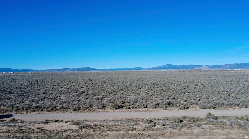 7.25acs in Beryl, UT with 0.5 Acre Foot of Water Right #71-5453 (Priority Date 4/12/1944). Zoned Agricultural 20, offering flexibility for a custom home, cabin, small farm, livestock, or private retreat. Dixie Power approx. 1,700 feet south with good year-round road access. Enjoy wide-open space, stunning mountain and valley views, peaceful surroundings, and dark night skies. Ideal for off-grid living, homesteading, recreation, or land banking. Newcastle Reservoir is just 20 minutes away for boating and fishing, with the nearby Hamlin Valley Mountains offering hunting and endless UTV exploring. Bring your toys and RVs. About 25 minutes to Enterprise for grocery, gas, etc. Roughly one hour to St. George or Cedar City. Rural freedom can be yours. Water right enough to drill a water well.