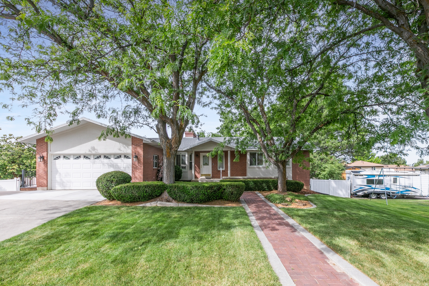 Tucked away on a quiet cul-de-sac in one of Fruit Heights' most desirable neighborhoods, this spacious 6-bedroom, 4.5-bath home offers the perfect combination of location, space, and versatility. With 3,486 square feet, two full kitchens, and room for everyone, this home is ideal for multi-generational living, entertaining, or simply spreading out and enjoying life. The functional floor plan provides generous living spaces, while the second kitchen creates endless possibilities for guests, extended family, or additional gathering space. Step outside to a huge deck overlooking the beautifully sized .42-acre lot-perfect for summer barbecues, relaxing evenings, and making memories with family and friends. The backyard is built for fun with a private sport court and plenty of room to play, garden, or simply enjoy the peaceful surroundings. Located in an exceptional Fruit Heights neighborhood known for its tree-lined streets, mountain views, and convenient access to schools, parks, trails, and commuter routes, this is a rare opportunity to own a home that truly has room for it all. Homes in this location don't come along often. If you've been looking for space, flexibility, and an amazing neighborhood, this is one you'll want to see in person. Call for a private tour.