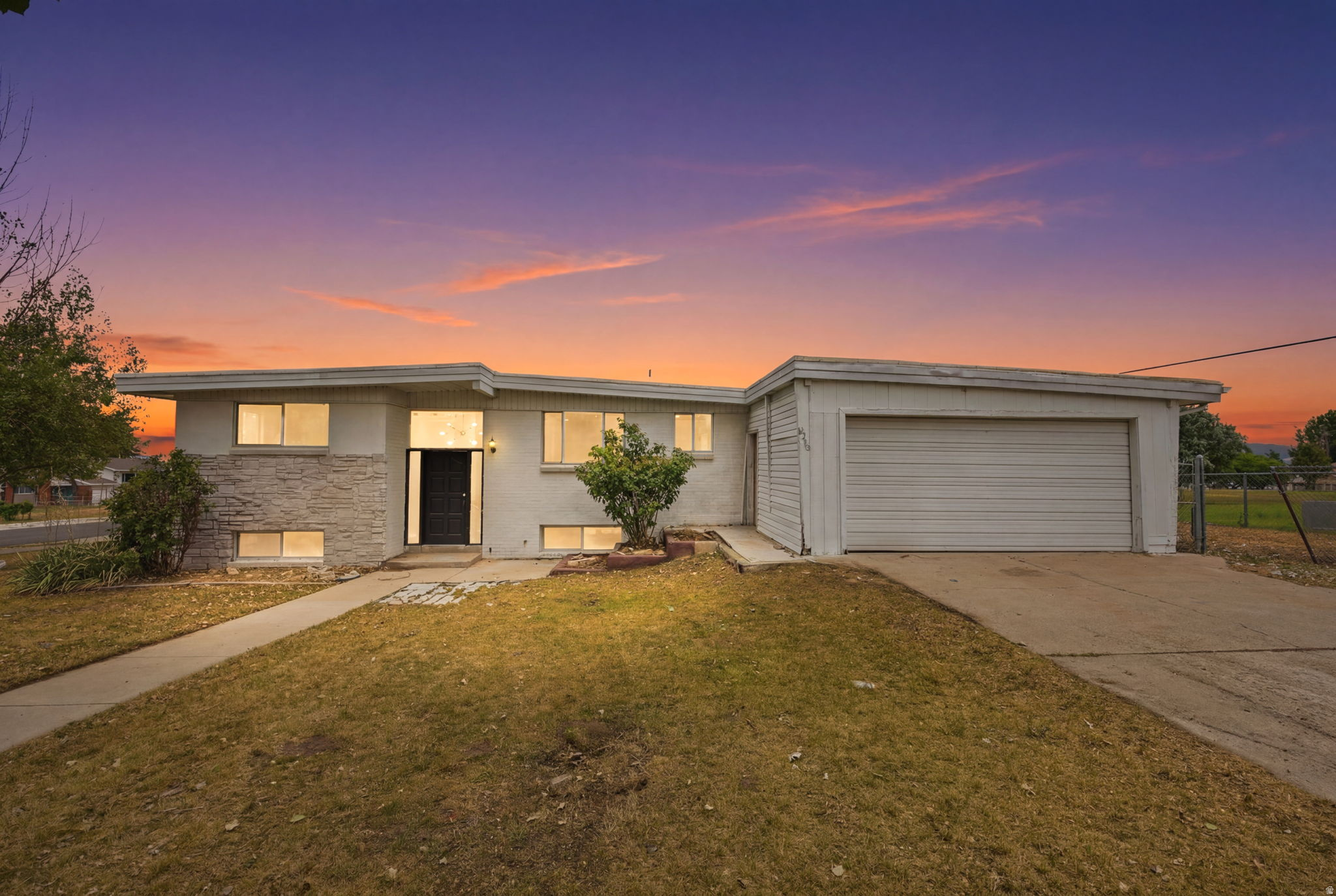 Beautifully remodeled 5 bedroom, 3 bathroom home in a prime Magna location! This move in ready property offers exceptional versatility with a fully finished basement featuring 2 bedrooms, 1 bathroom, a full kitchen, laundry area, and a separate entrance, ideal for extended family, guests, or potential rental income to help offset your mortgage.  The main level features 3 spacious bedrooms, 2 bathrooms, and a stunning remodeled kitchen with quartz countertops, complemented by an open and inviting living area. Recent updates include a new roof, updated HVAC system, new flooring, carpet, lighting, and beautifully renovated kitchens with quartz countertops throughout.  Outside, enjoy a spacious 2-car garage, RV parking, and plenty of room for additional vehicles, trailers, or recreational toys. Conveniently located near shopping, grocery stores, restaurants, schools, parks, and major commuter routes, this home offers the perfect combination of comfort, style, and functionality.  Ask us how your monthly payment could be as low as $1,800/month (subject to buyer qualification, loan terms, and lender approval). Seller concessions are available when using our preferred lender, making this an even more affordable opportunity.  Whether you're looking for a beautiful primary residence or a home with excellent income potential, this property checks all the boxes. Schedule your private showing today, this one won't last long!