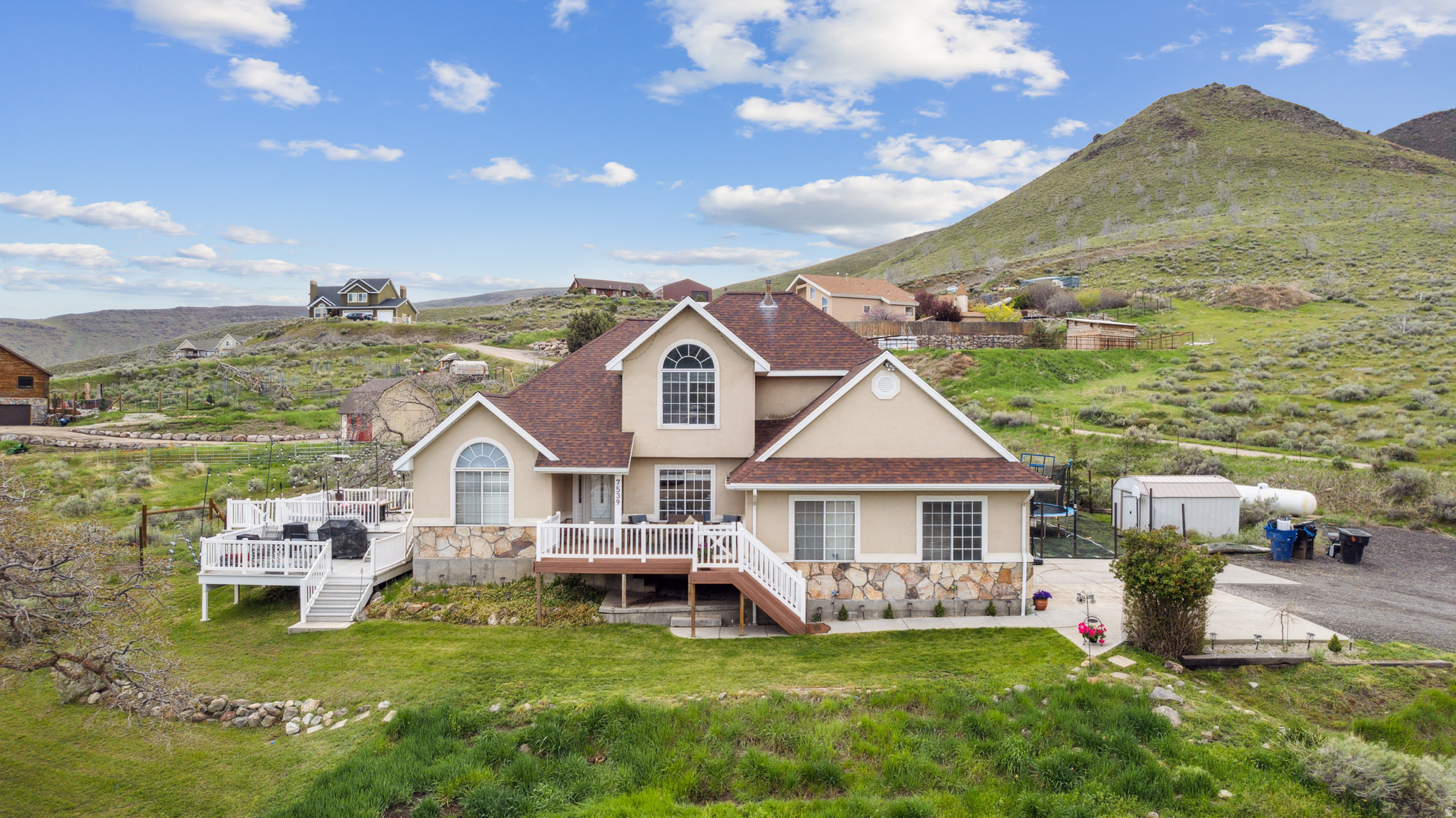 Your Private 2.5-Acre Sanctuary. Whether you dream of a premier horse property, a hobby farm for goats and chickens, or simply room to breathe, this expansive Herriman ranch delivers. Nestled at the southwest edge of the valley, you'll enjoy wildflower-filled mornings and starlit nights with Yellow Fork Canyon trails just moments from your door. The estate is fully equipped for work and play with a horse barn, corral, a separate shop, and an additional 2-car detached garage. Inside, the home offers incredible flexibility with a modern 3-bedroom basement apartment-perfect for multi-generational living or as a high-potential rental to offset your mortgage. Escape the city hustle without losing the convenience; you're just 45 minutes from the airport and downtown SLC.