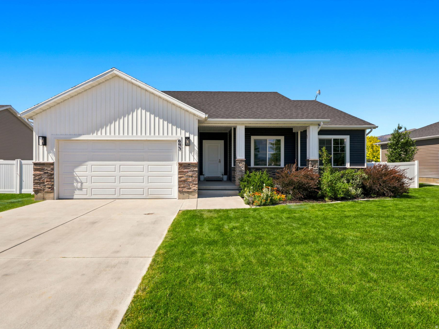 This beautifully designed rambler offers the perfect blend of space, comfort, and natural light. Featuring 6 bedrooms, 3 bathrooms, and an abundance of  windows, the home is filled with sunshine and showcases stunning mountain views from multiple rooms. The spacious kitchen is highlighted by elegant granite countertops and ample cabinetry. 2 family areas create plenty of room  for everyone to relax, play, or host guests. A cozy reading nook provides the perfect retreat for quiet mornings, while a dedicated office offers an ideal work-from-home setup. You'll find a fully fenced yard surrounded by mature landscaping, creating a peaceful and private outdoor oasis. Combining generous living space, beautiful views, and desirable features throughout, this home is ready to welcome its next owners.