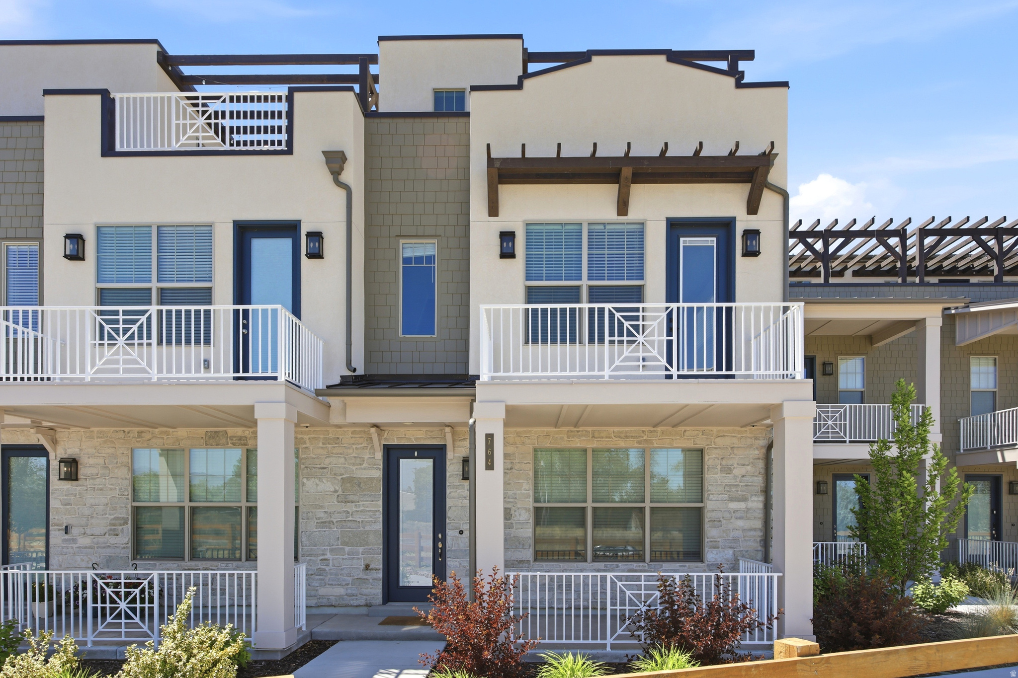 Beautiful modern townhome in a convenient Murray location with mountain and valley views. Built in 2023, this home offers a clean, newer feel with an open main living area, bright kitchen, quartz countertops, stainless steel appliances, and gas range.  Upstairs features three bedrooms, including a comfortable primary suite with private bath and walk in closet. The home also includes laundry, three bathrooms, and an attached two car garage.  Enjoy low maintenance living with an HOA that covers maintenance, snow removal, trash, sewer, playground, and more. Great central location near schools, shopping, dining, parks, and freeway access. Clean, modern, and move in ready.