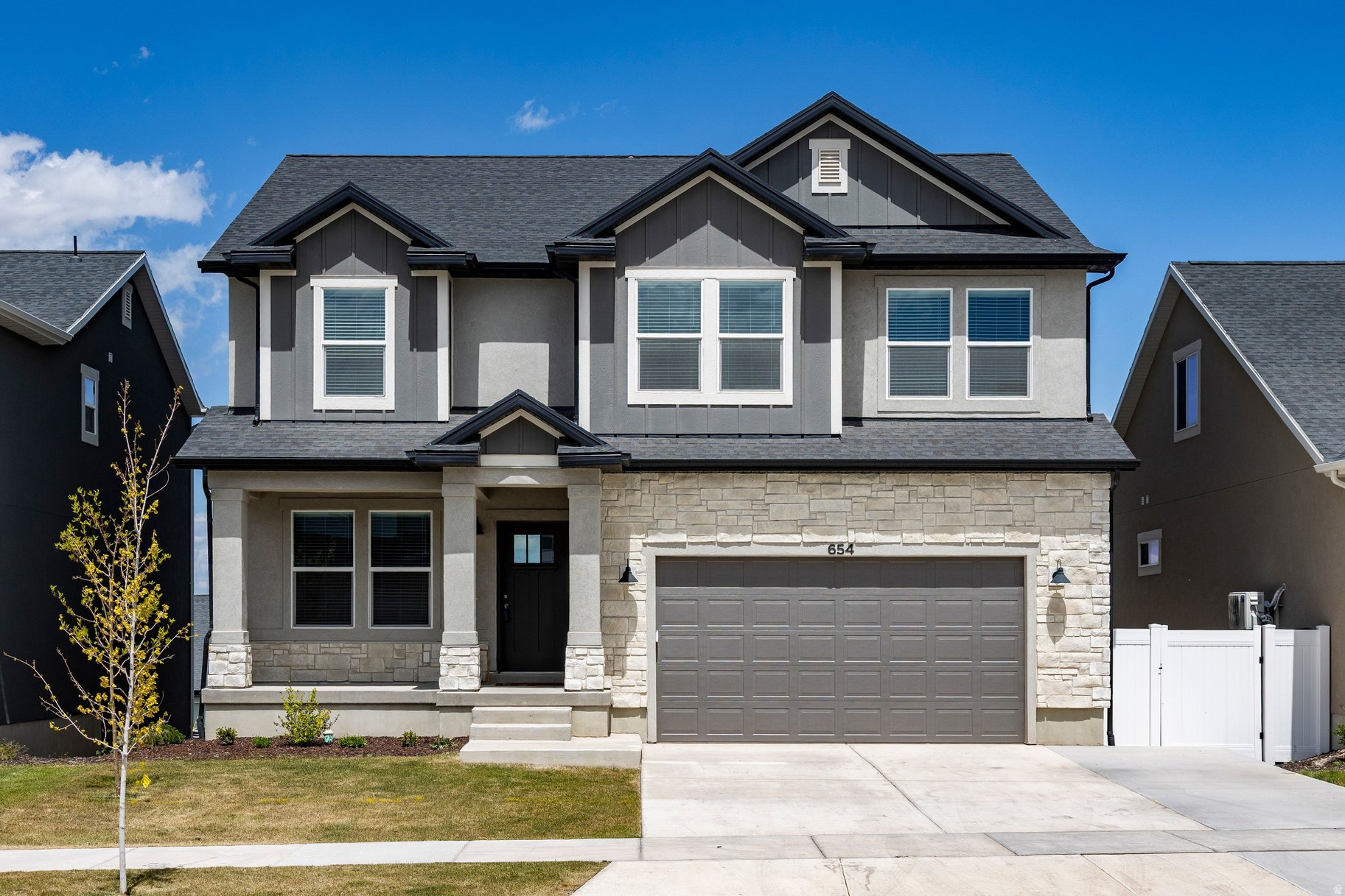 **1% closing cost credit available for qualified buyers using American Pacific Mortgage financing. Terms and conditions apply. Not all borrowers will qualify.**Recently repositioned at $725,000, this 2024-built home in the highly desirable Highridge Edge community presents an exceptional opportunity for modern living with built-in flexibility and income potential. Thoughtfully designed with elevated finishes throughout, the main level features vaulted ceilings, a fireplace, and a modern kitchen that balances style and function. Expansive windows fill the home with natural light and frame sweeping valley views. Upstairs offers a spacious primary suite with French doors, walk-in closet, and spa-inspired bath, plus two additional bedrooms, a full bath, and an upstairs laundry, all enhanced with upgraded 9' ceilings.The walk-out basement includes a fully equipped ADU with strong versatility for multigenerational living or rental income, with recent rent at $1,500 per month and potentially more. A rare bonus is the finished, insulated garage space previously set up for a dog grooming business, offering an ideal setup for a studio, salon, or creative workspace with endless possibilities. Enjoy resort-style amenities including a pool, clubhouse, fitness center, pickleball courts, parks, playgrounds, and miles of trails. Conveniently located near Redwood Road, The Ranches Golf Club, Utah Lake, and UT-194. A rare chance to secure a versatile, income-producing home in one of Saratoga Springs' most sought-after communities at a newly adjusted price point.