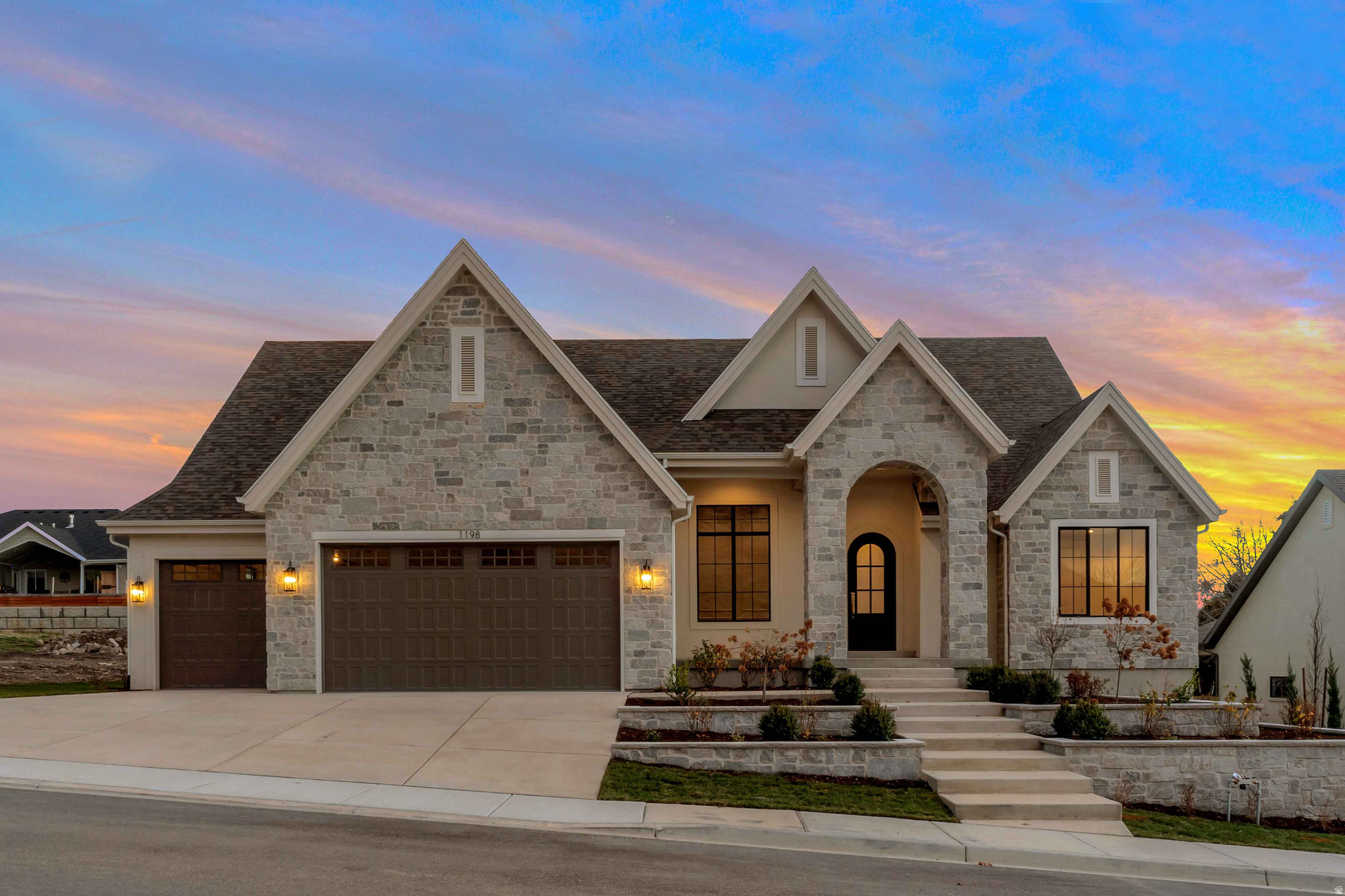 LOT#119 in Symphony Homes' Blossom Hills community on the east bench, offering spectacular lake and mountain views. This beautifully crafted 'Octave' plan blends a thoughtful floorplan,design, and high-end finishes. Enjoy stunning interior details like custom millwork in the flex room, finish carpentry around the fireplace, and ceiling beams in the family room for added charm. The kitchen features premium ZLINE appliances, including a 48" dual fuel range w/ 7 burners, a fridge/freezer combo, and a butler's pantry with countertop and outlets. Unique "pocket office" adjacent to kitchen. The main-floor primary suite includes a freestanding tub and a large custom walk-in closet. The 2nd bedroom on the main level features an en-suite bathroom. Mudroom with built-in lockers adds everyday convenience. The finished basement includes a spacious family area, wet bar, cold cellar, 9' foundation walls, and plenty of storage. A covered patio and fully landscaped yard complete this exceptional home.