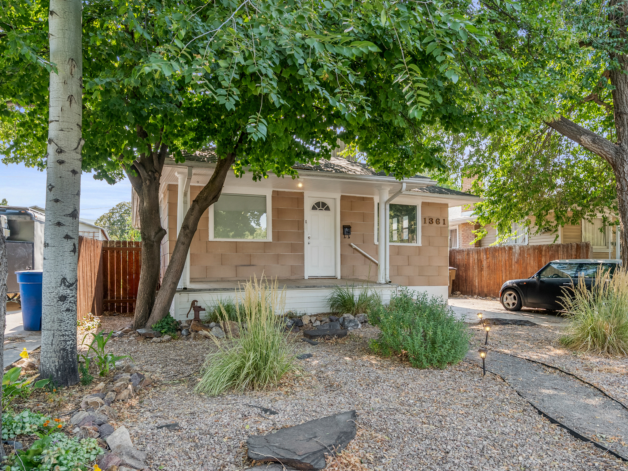 *NEW HVAC AND UPDATED KITCHEN*  Welcome to this charming bungalow boasting plenty of curb appeal. Inside, you'll discover an updated kitchen and bathroom, along with an adorable living room and two spacious bedrooms. The downstairs area includes an unfinished bedroom and bathroom, offering you the chance to personalize it. Outside, the front yard features native plants and trees, while the large private backyard serves as a blank slate for your ideas. Additional amenities include RV parking and a small one-car garage. Square footage figures are provided as a courtesy estimate only and were obtained from County Records.  Buyer is advised to obtain an independent measurement.