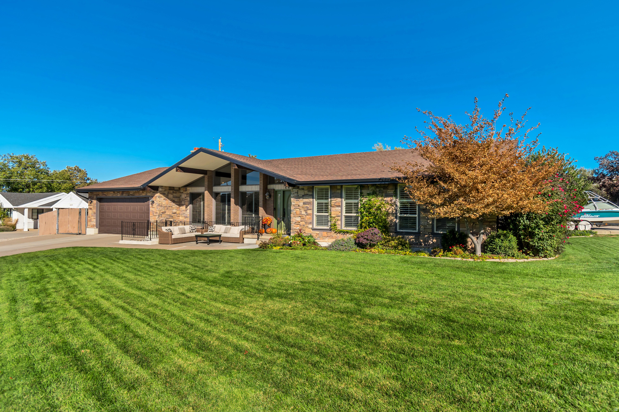 Welcome to one of the most desirable neighborhoods in Salt Lake City! This stylish Mid-Century Modern home sits on a mature landscaped corner lot in the heart of East Millcreek, offering breathtaking views of Mt. Olympus! Your guests will always feel welcome once they step onto the inviting front porch and walk into this stunning home with an abundance of natural light. You will appreciate the 'never been lived in' newest renovation of the upper floor. The spacious kitchen was designed with both beauty and functionality in mind with Quartz countertops and full height backsplash, soft close two-toned wood cabinetry with rollout drawers and hidden spice racks. Designer hood, pot filler, cook top and island microwave. Enjoy all the family time and entertaining at the 14 sq. ft. eat-in island. Have peace of mind with the newer roof, windows, air conditioner and two furnaces. Whether you are seeking a full 7 bedroom/ 4 bath family home or a flexible layout with an income producing mother-in-law apartment, this home gives you the best of both worlds. This immaculate home is truly one of a kind and has been loved and taken care of meticulously by the original family owners. Perfectly located and close to top-rated schools, shopping, dining and close proximity to the freeway systems. Only minutes to the University of Utah, downtown, Salt Lake International airport and five scenic canyons ideal for skiing, biking, hiking, nature walks, water sports and more! Don't miss out on owning this gem of a home! ***FOR ADDITIONAL HIGHLIGHTS OF THE HOME, PLEASE SEE THE ATTACHED DOCUMENT***