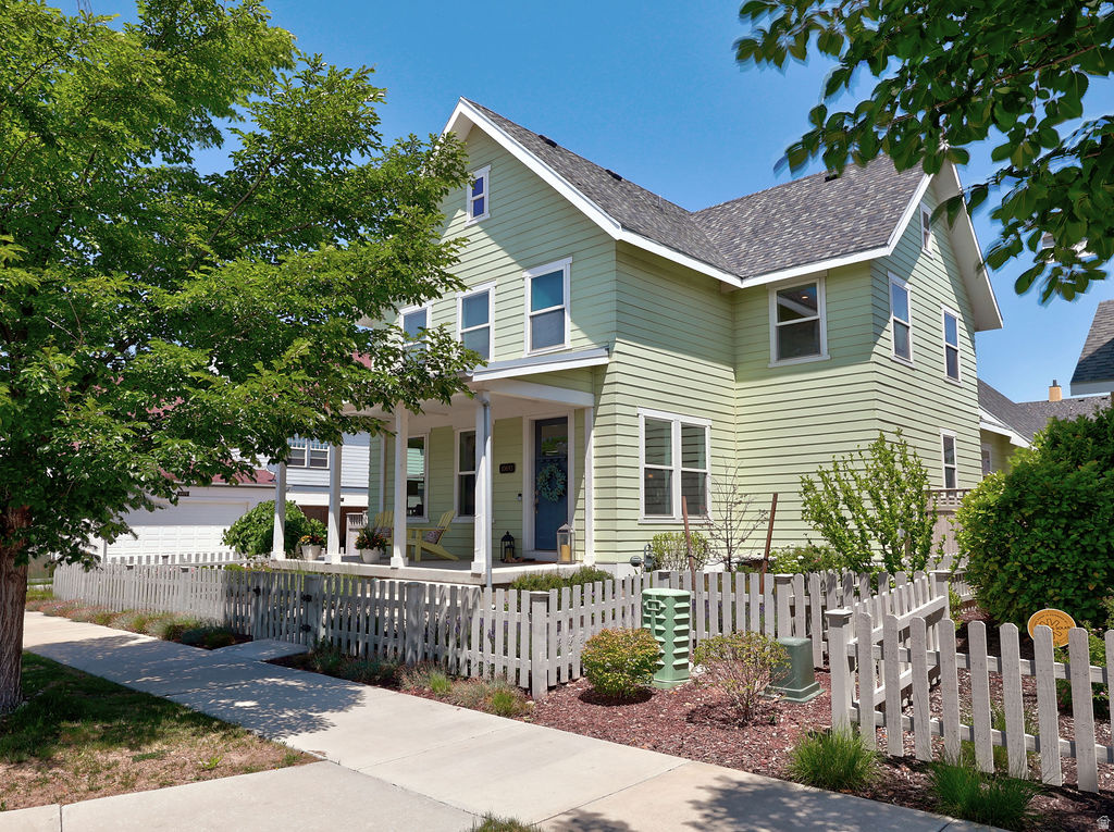 Charming and beautifully maintained Daybreak home in a prime location! Nestled on a quiet street just one block from the Oquirrh lake, this like-new two-story offers the perfect blend of comfort, character, and convenience. The open-concept floor plan features a chef kitchen with a large gathering bar, ideal for entertaining. The main floor has elegant window trim and custom moldings that add warmth and character throughout. The spacious primary suite includes separate his-and-hers closets and a luxurious ensuite bath featuring a Euro glass shower and a relaxing soaking tub. Outside, enjoy the welcoming picket fence, low-maintenance landscaping, and a private backyard retreat surrounded by mature landscaping-perfect for relaxing or entertaining. Meticulously cared for and move-in ready, this exceptional home offers the best of Daybreak living just steps from the lake, trails, parks, and community amenities.