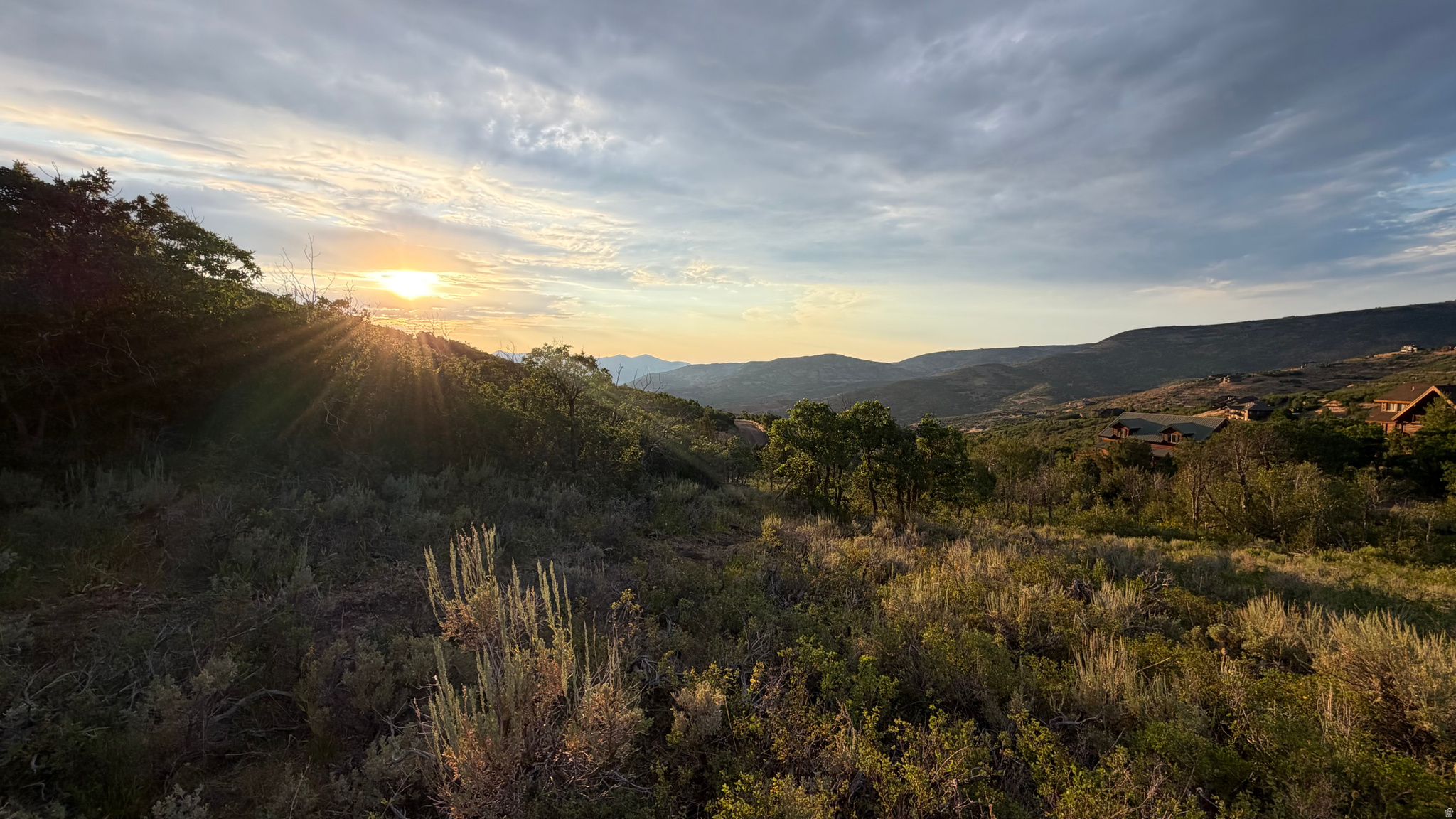 Rare opportunity to own an incredible 1.50-acre homesite tucked away at the end of a quiet cul-de-sac in the sought-after Timber Lakes community. Backing over 1,700 acres of privately owned land, this property offers exceptional privacy, expansive mountain views, and breathtaking vistas of Deer Valley. The gradual slope is beautifully covered with mature oak trees, while a cleared walking path allows you to easily explore the property and experience multiple potential building sites. Enjoy spectacular sunsets, abundant wildlife, and the peaceful mountain setting that makes Timber Lakes so special. Adventure begins right outside your door with private lakes for paddling, miles of hiking and biking trails, and direct access to snowmobiling via the community easement during the winter months. Just 10 minutes away, the Uinta Mountains provide access to thousands of miles of off-road trails and endless year-round recreation. Community events and activities hosted throughout the year create a welcoming mountain lifestyle, making this an ideal location for either a full-time residence or weekend retreat. The electrical impact fee for 200-amp service has already been paid, representing a value of over $6,000. A perc test will be required to determine the approved building envelope and septic location, and a topographic survey is currently in progress. Be sure to watch the video tour to fully appreciate the setting. Home renderings shown in the video are for illustrative purposes only and are not representative of an approved building plan. Don't miss this chance to build your dream mountain escape and enjoy cooler summer temperatures, unmatched privacy, and some of the best views in Timber Lakes.