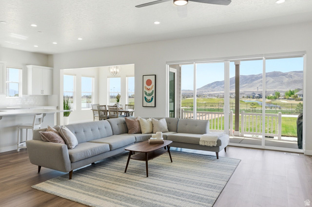 Stunning Daniel 2 floor plan on a unique .30-acre lot with exceptional views over open space, the waterway, and Patriot Park. This beautifully designed home offers expansive open-concept living with soaring 10' ceilings, 8' doors, and abundant natural light throughout. The gourmet kitchen is a standout with quartz countertops, double ovens, gas cooktop, oversized 11' island, and a large walk-in pantry, all opening to the spacious great room and sunroom. A dramatic 12'x8' center-meet sliding glass door leads to the 10'x17' covered patio, creating seamless indoor-outdoor living. The main-level primary suite features a deluxe bath with Euro glass shower, rain shower head, and large walk-in closet, instant water-heater, plus a private office with French glass doors. The finished basement adds a bedroom, full bath, flex room, large family room, plumbing for kitchenette and excellent storage.  Back landscaping partially finished with Gazebo pad & willing neighbor to share fencing cost.  Close to parks, trails, pickleball, shopping, dining, and Talon's Golf Course.