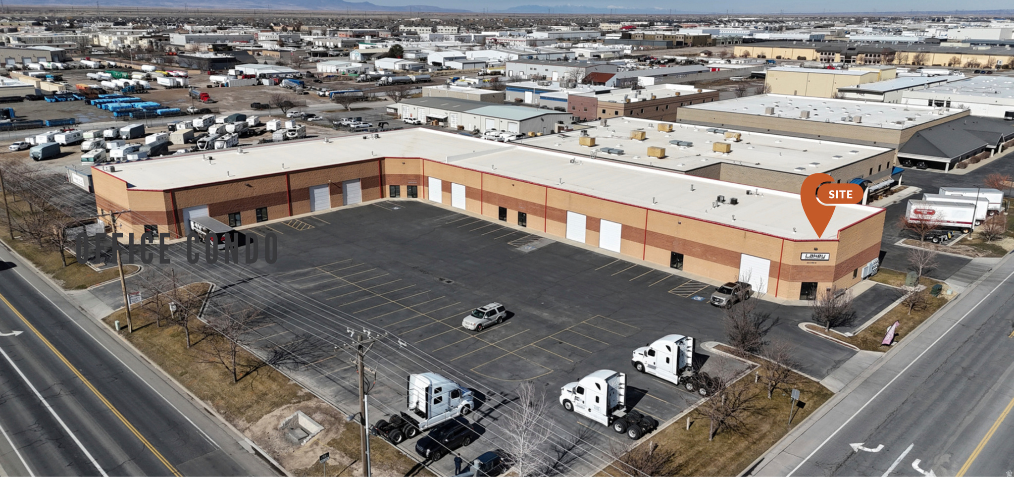 2,950 SF industrial/flex space featuring a 12x14 GL door, 20' clear height, 3-phase power, and ample parking. The layout includes a 30x42 shop area, 7 offices, a reception area, a secure storage room, and 2 bathrooms. Located in NSL's MD zone with recent updates to paint, carpet, and bathrooms.