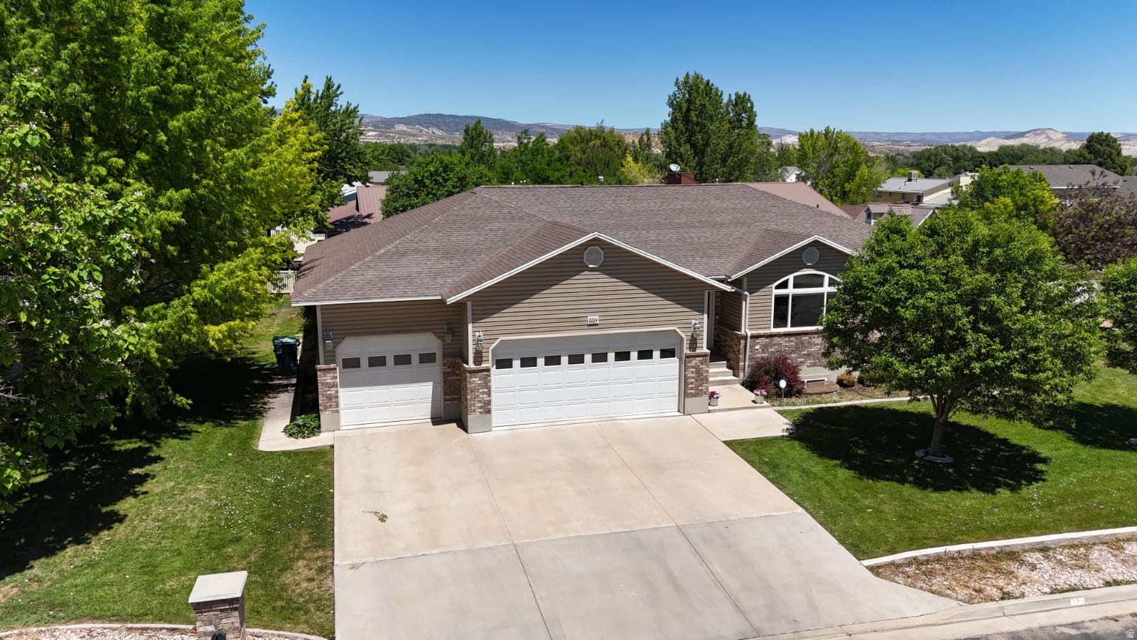This well-maintained 5-bedroom, 3.5-bath rambler offers space, functionality, and comfort in a quiet Vernal neighborhood. Built in 2002 and situated on a generous 0.42-acre corner lot, the home features a fully finished basement, a custom kitchen with island, and multiple living areas including a den/office and spacious family room. The primary suite includes a walk-in closet and a separate tub and shower, creating a private retreat within the home. Outside, you'll find a fully fenced yard with mature landscaping, automatic sprinklers, and a covered patio perfect for relaxing or entertaining. The property also offers exceptional parking and storage options, including a 3-car garage space, and dedicated RV parking. Located close to schools and town amenities while still offering a slower-paced, quiet setting, this home provides the best of both convenience and space. Square footage figures are provided as a courtesy estimate only and were obtained from county records.  Buyer is advised to obtain an independent measurement.