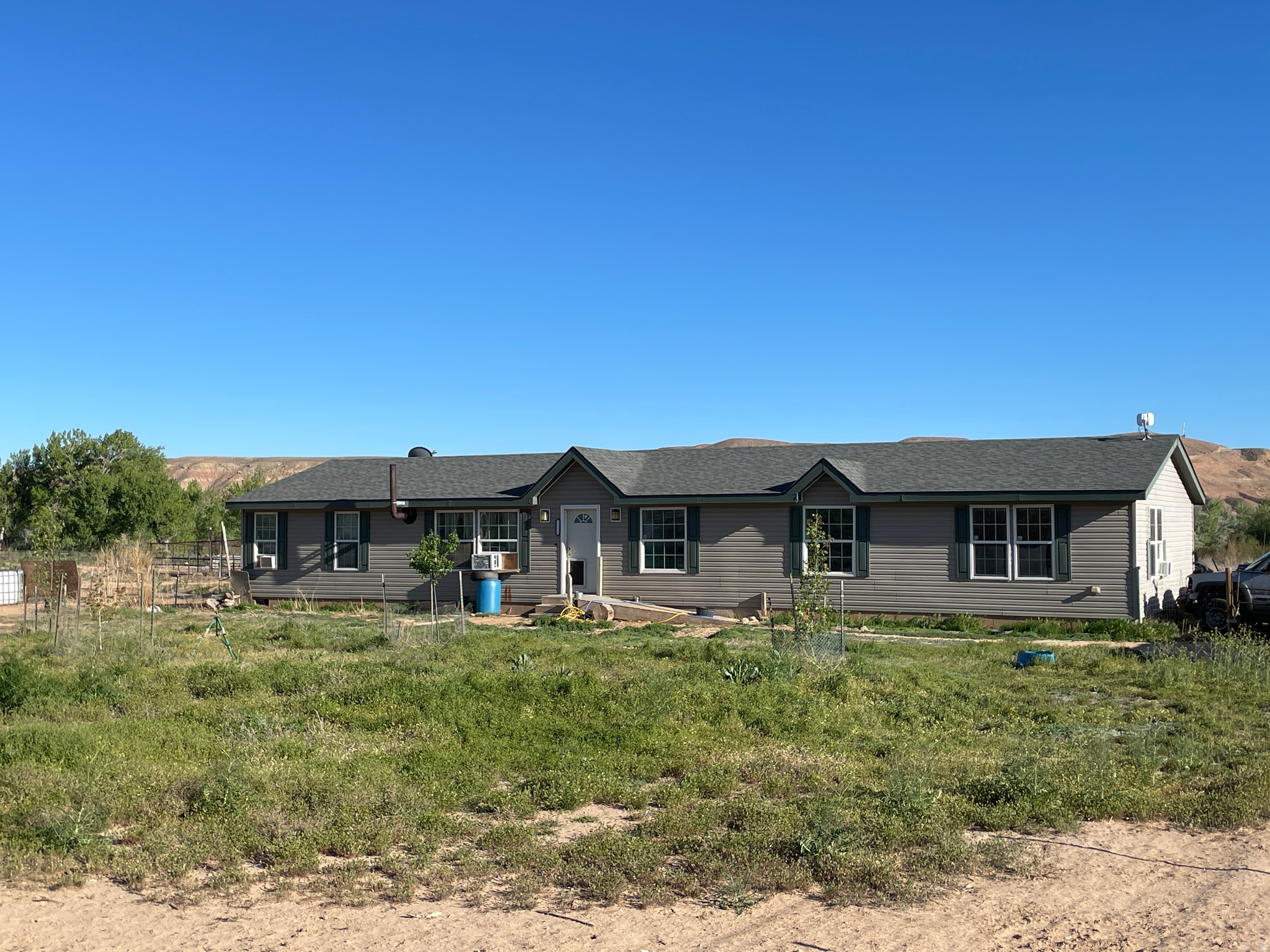 Make your homestead dream a reality, in this spacious home on over 10 acres with PRIVATE RIVER ACCESS, 4 water rights, and newly planted trees! The country life is calling your name with plenty of space to grow a garden, make a small hobby farm, raise horses, build an arena, or expand to a ranch. There's even room to build a huge shop and still have lots of RV and toy parking! Enjoy the wildlife and beautiful views surrounding this home. Corrals stay with the property and measure aprox. 90'L X 30'W X 5'H; there is water at the corrals. Firewood included, structures made of pipe are NOT included. Sqft and lot size obtained from county records and independent measurement.  Buyer to verify all info.