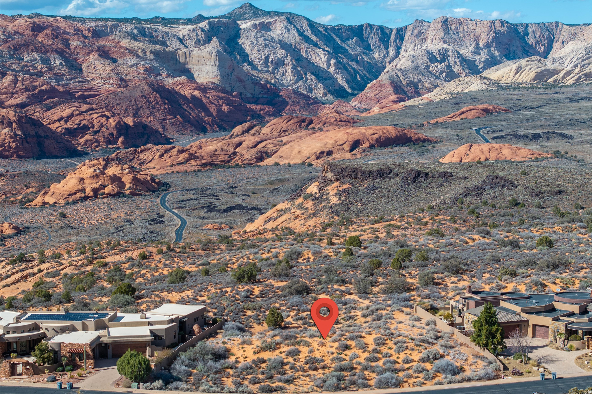 Rare opportunity to own one of the final premier rim lots backing directly to Snow Canyon State Park. This .59-acre parcel provides a private, unobstructed vantage point over iconic red rock cliffs, ancient lava flows, and sandstone formations. Located within the secure, gated Ledges community, the property offers a protected natural backdrop that ensures no future development will ever mar your views. The flexible topography perfectly suits a sleek single-level ranch or a sophisticated multi-level estate with a walk-out basement. Enjoy elite resort living with access to the 18-hole championship golf course, clubhouse, and miles of hiking and biking trails. Secure your place on the rim where the landscape defines your lifestyle.