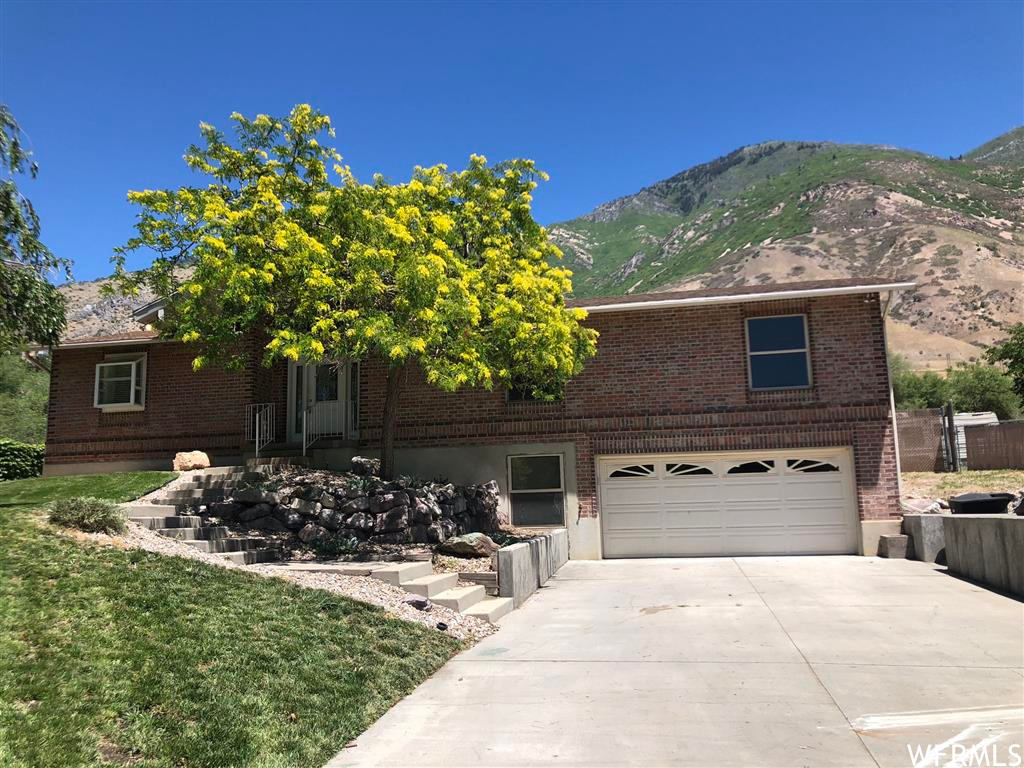 HOME WAS WITHDRAWN AND RELISTED AS OF 4/17/2026. Large Home with Huge Fenced Lot with Tons of Potential. Open Living, Kitchen & Dining Space with Double Sided Gas Fireplace. Hardwood Floors, Large Bedrooms & Closets. Second Kitchen in Basement with Woodburning Stove. Amazing Views, Double Patios and Automatic Sprinklers. New AC, Furnace & Water Heater. Super Nice 1200sf 4 Car Shop/Garage with 220v, Gas Heater & Cooler. Tons of Storage, RV Pad, Long Gravel Driveway & Much More.
