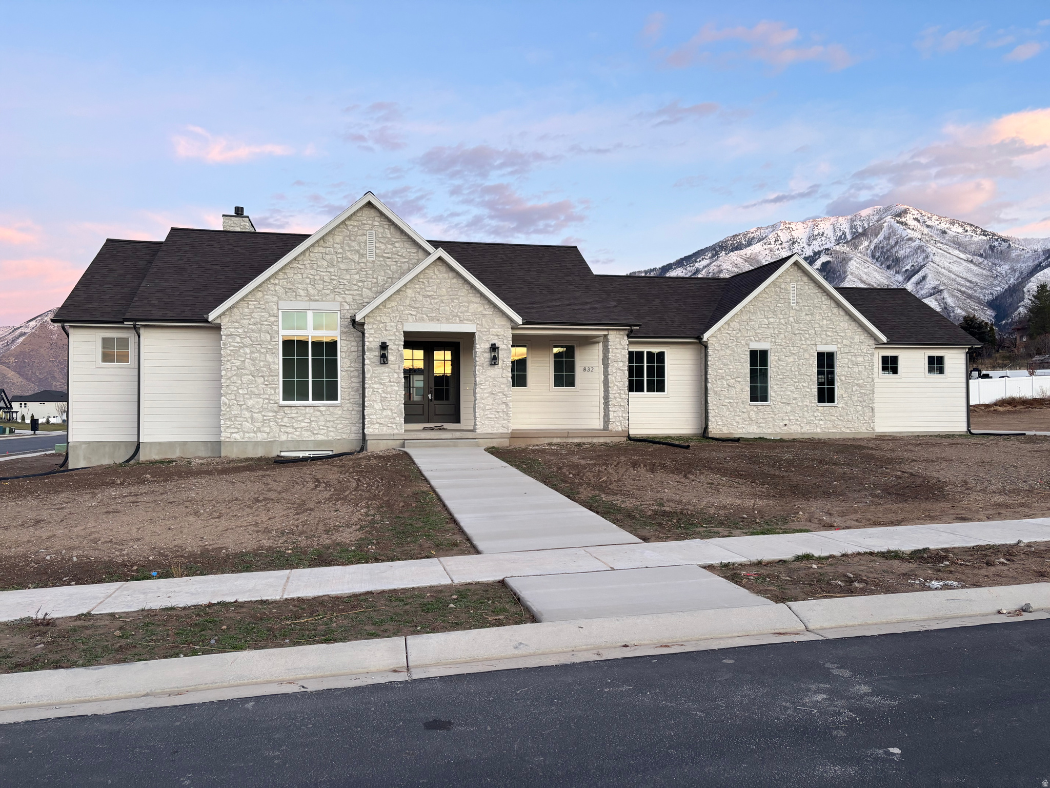 Nestled in the highly sought-after, quiet and secluded neighborhood of Elk Ridge, this brand-new luxury custom-built home offers the perfect blend of modern elegance and serene mountain living. Perched in the foothills of the Wasatch Mountains, enjoy beautiful mountain and valley views that stretch across Utah Valley.  Spacious 1/2 acre lot with rare animal rights ideal for a small homestead or hobby farm.  Designer finishes and upgrades throughout.  Gourmet kitchen with elegant quarts countertops and white oak cabinets.  Convenient butler's pantry for seamless meal prep and entertaining.  Massive walk out basement perfect for creating the basement of your dreams or turning it into an ADU.  Oversized 3-car garage plus ample space on the lot for RV parking. Experience the tranquility of Elk Ridge's exclusive foothills while being just minutes from outdoor recreation, golf courses, and a convenient 20 minute drive to Provo. This is a rare opportunity to own a turn-key luxury home in one of Utah County's most desirable areas.