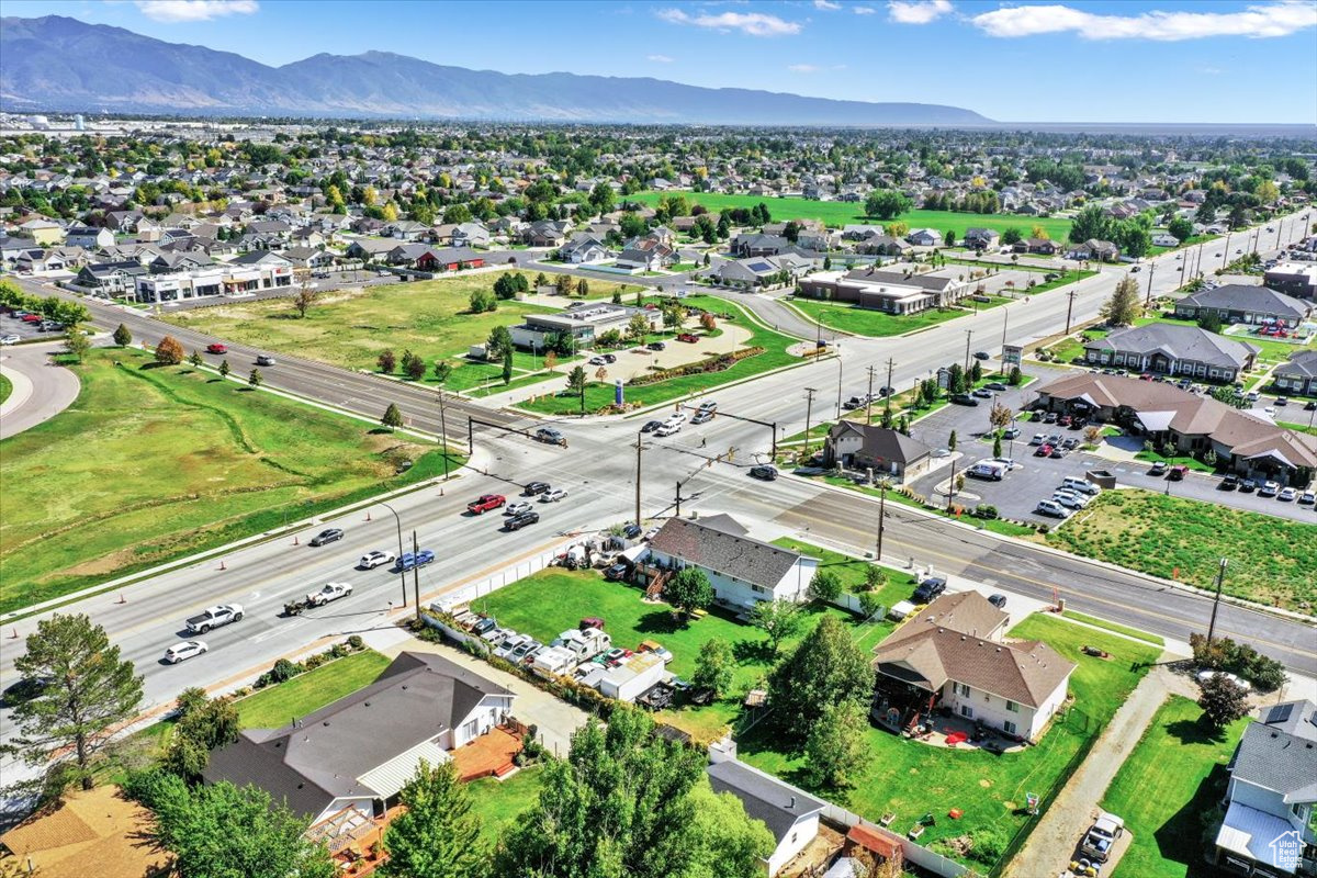 *** HIGH TRAFFIC CORNER ACROSS FROM SYRACUSE HIGH SCHOOL AND ZEPPES *** Current zoning is R1, but slated to be General Commericial in the master plan.  House is currently occupied.  Do not disturb occupants.