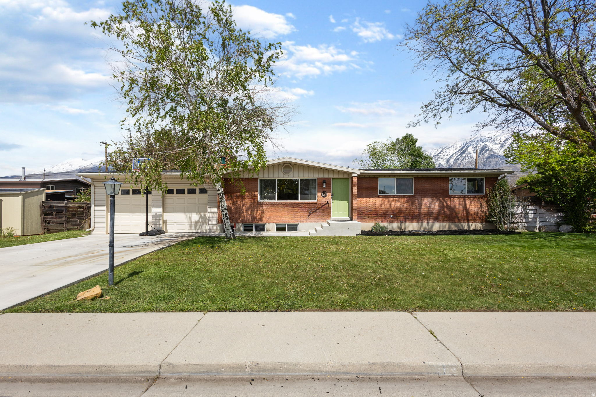 Fantastic west-facing Rambler located on the East side of Orem.   Completely renovated with new bathrooms, kitchen, windows, appliances and flooring all while leaving much of the 60's charm intact.  Brand new roof put on in April.  Mature landscape, fruit trees, large garage with ample storage and workbench, rv parking, views of the mountains, quiet road and close to Orem high.  Bamboo flooring, covered patio, large living room and fireplace.  Beautiful home.  Will go fast!
