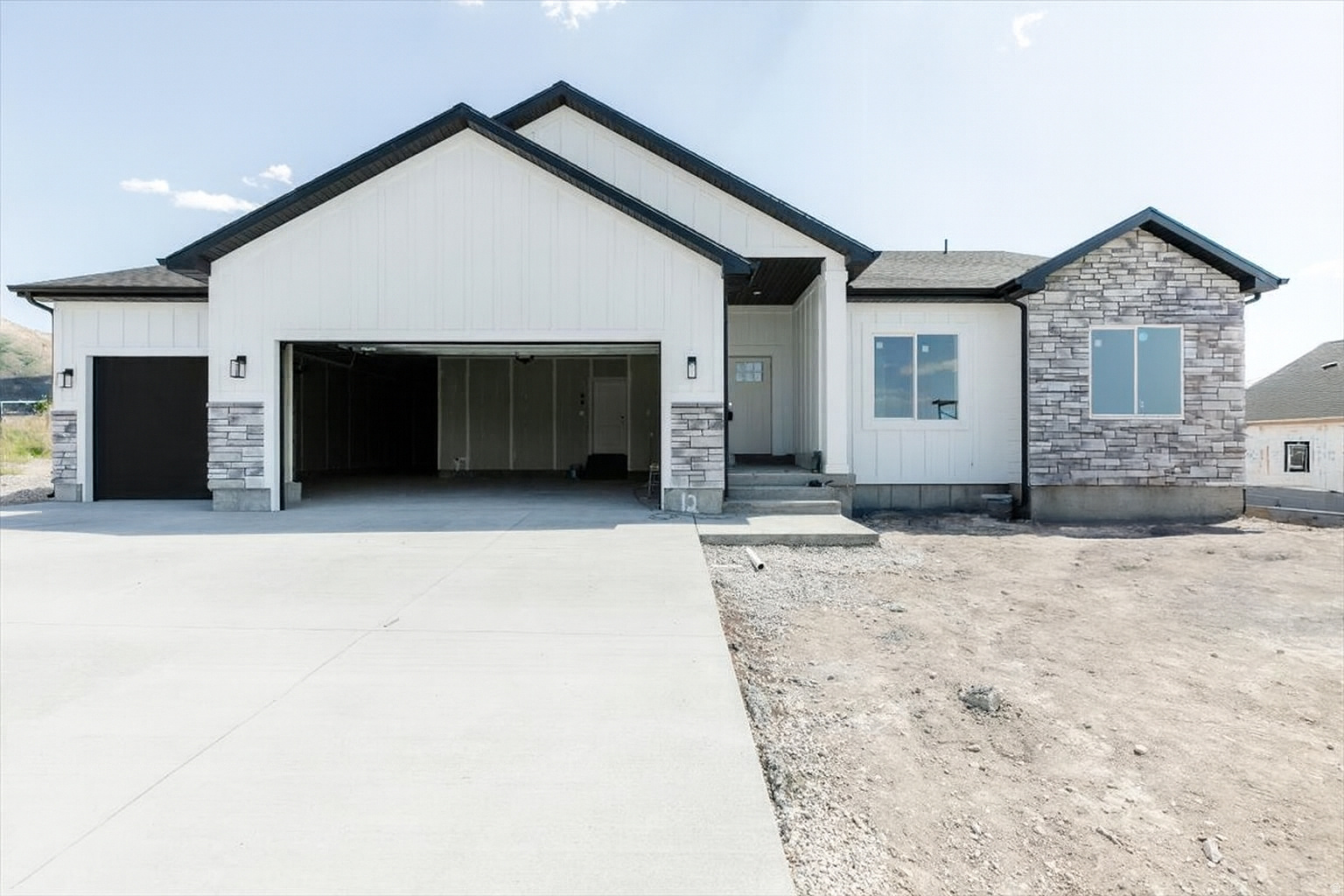 New custom home with great upgrades: paint-grade cabinets, quartz countertops, double ovens, included fridge, tiled bathrooms, fireplace, amazing pantry, and a primary bath with a separate tub and shower. Features 9' ceilings, a large 0.28-acre lot, and an extra-deep oversized garage. Home is scheduled to be finished by the end of January. Photos show an almost completed home with the same plan and finishes, just mirrored.
