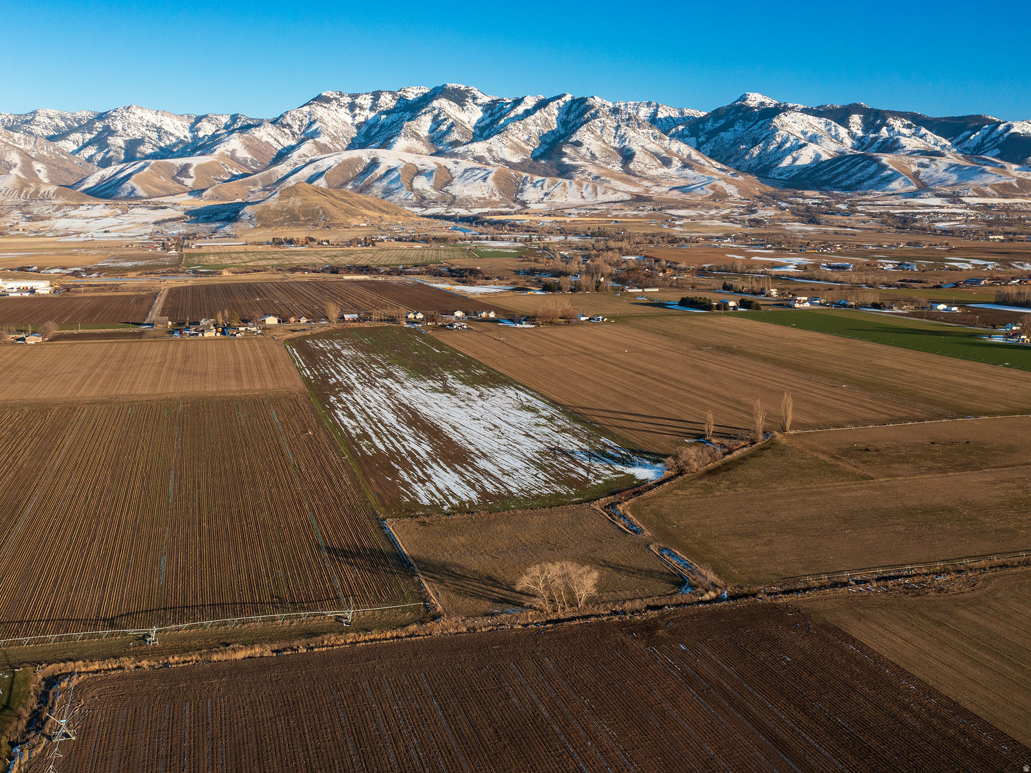 Is the farm life calling your name?  This quaint farming community is  so inviting and breathtaking! The seller made sure to leave the old homestead structure on the property to ease the building permit issues and impact costs. Just outside of Logan, Utah and less than an hour from Bear Lake for the water lovers, is where you will find this gem! The land is flat, the soil is rich, and the water that comes with the property seals the deal! **IF YOU ARE USING REDFIN OR ZILLOW WEBSITES THEY ARE MISADVERTISING THIS LISTING! FOR THE MOST ACCURATE INFORMATION PLEASE USE www.UTAHREALESTATE.COM  This list price is per acre** The water alone is worth thousands!