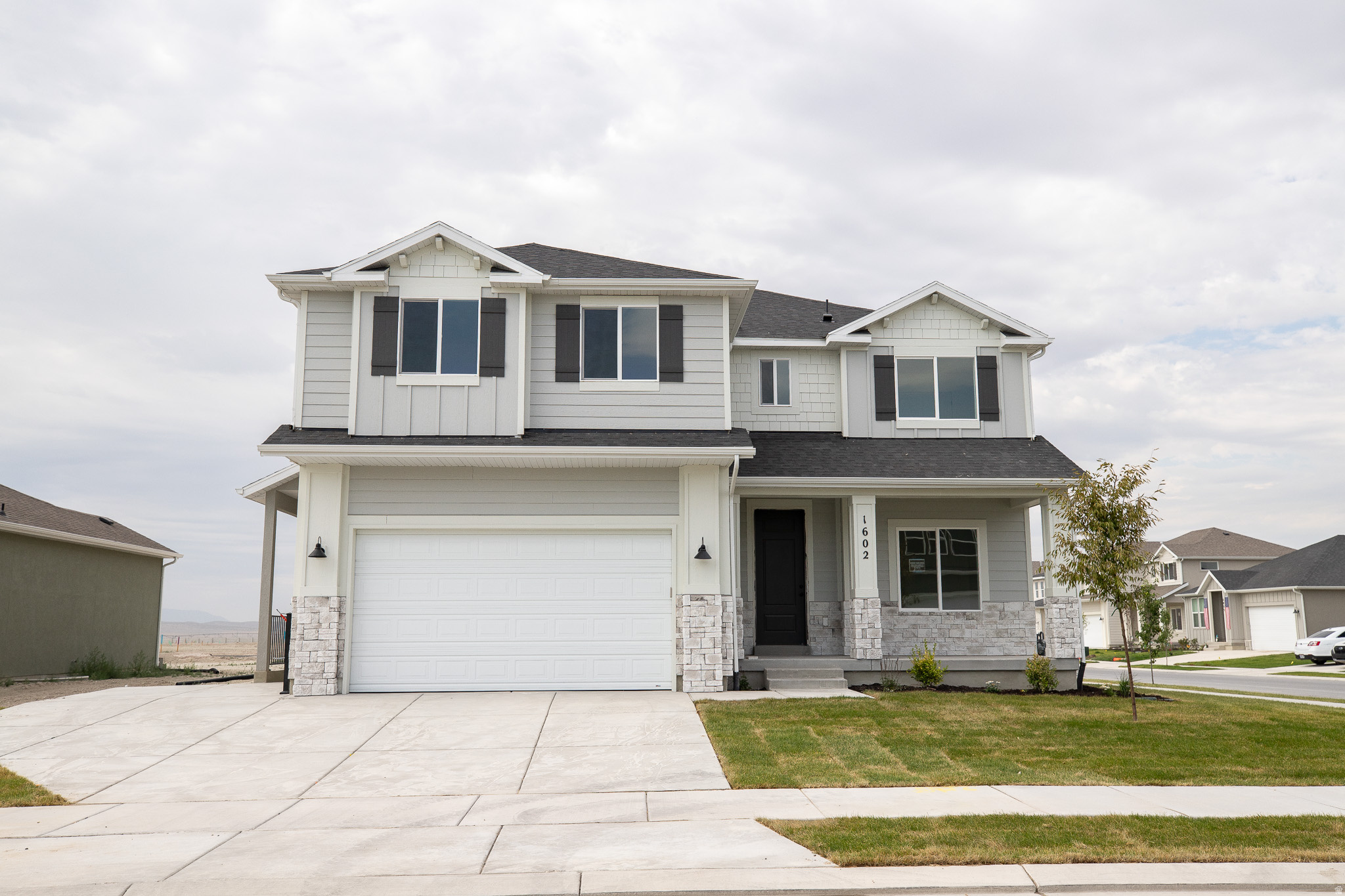AMAZING $20,000 TOWARDS CLOSING COSTS, RATE BUYDOWN, OR PRICE REDUCTION REGARDLESS OF LENDER! Must-see Parkway Fields Community in Eagle Mountain! Move-in ready! This beautiful home built by Flagship Homes features 4 bedrooms, 2.5 bathrooms, quartz slab countertops, painted cabinets, laminate flooring on the main level, a large loft on the 2nd floor, a completed basement entrance with plumbing for kitchen and washer in basement, landscaped front yard, 2 car garage, and backyard (can be landscaped for an additional charge). The backyard is bounded by a decorative concrete wall. The primary bedroom has a vaulted ceiling, large walk-in closet, and dual sinks with a separate tub/shower. With an unfinished basement, this home provides an opportunity for an ADU as well as space for storage and room to grow. (If preferred, basement can be finished for an additional charge.) Call for more information or stop by our model home at 1546 E. Starling Lane, Eagle Mountain for a tour. Model home hours: Monday-Saturday 11 AM - 6 PM. Buyers to verify all information. Square footage is from house plans.