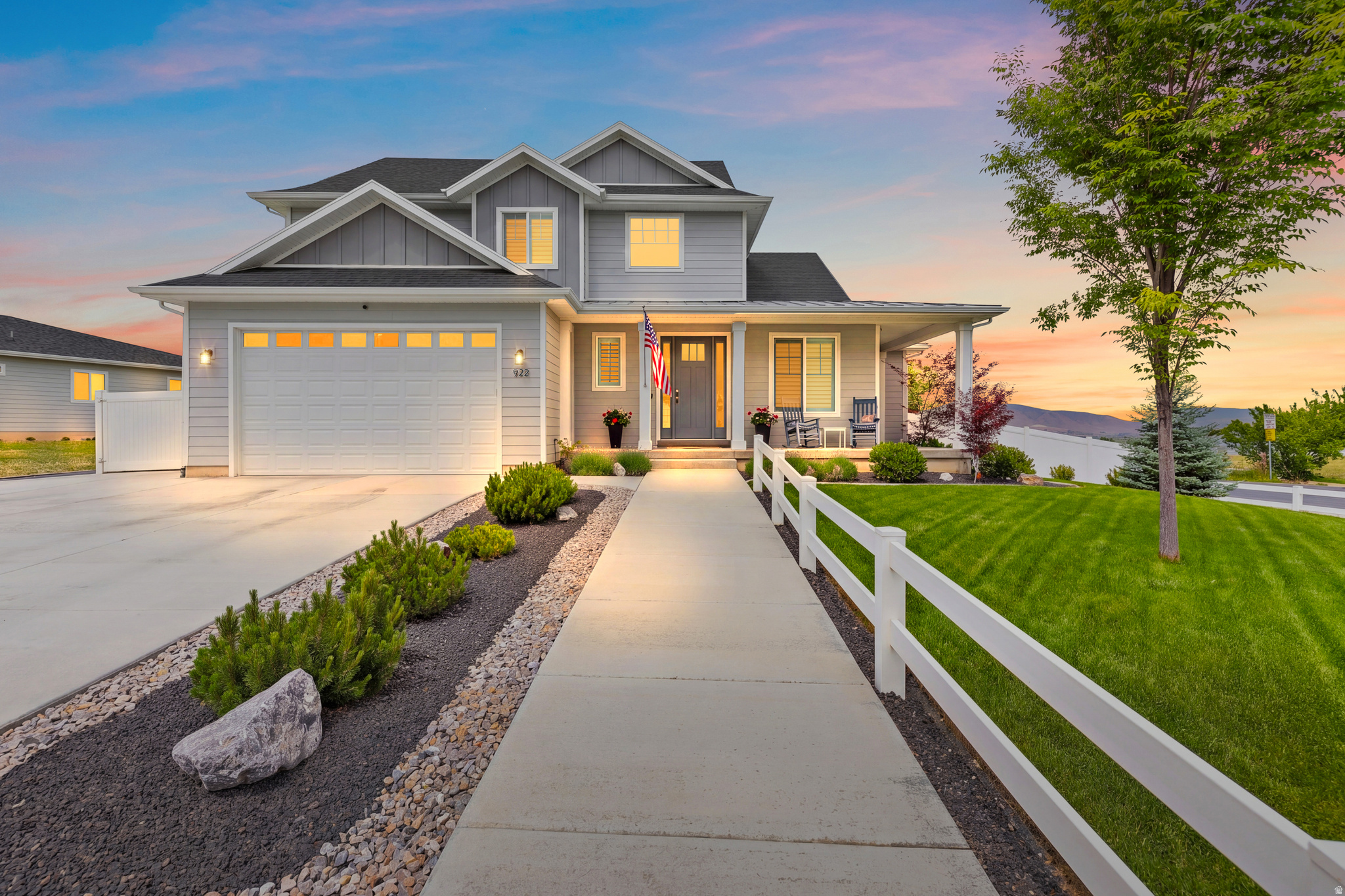 Come see this immaculate home with 5 bedrooms, 3.5 baths and a wraparound porch with mountain views. Upstairs has a spacious primary bedroom, custom ensuite with separate jetted tub and tiled shower, and a walk-in closet with barn door. Upstairs also includes 3 additional bedrooms and a full bath. Main floor offers an open kitchen, soft close cabinetry, and beautiful evening sunsets. Fully finished daylight basement features a 5th bedroom, full bath, gym and rec room area, large laundry plumbed for a sink, oversized pantry, and cold storage. Professionally landscaped front and back. Tesla charger and shed included. Show with 2-hour notice. Buyer to verify all information which is provided as a courtesy.   Call Listing agent  Julie Partridge Stuart for more information  801-687-0239