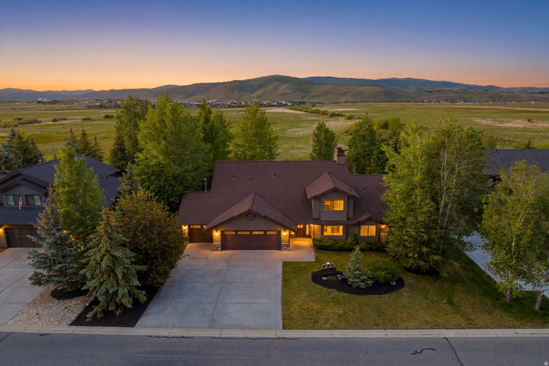 Backing directly to Swaner, the Main Floor Living Home embodies Ranch Place at its finest. Wake up to sunshine, step out your own back gate to Swaner Nature Preserve, and find yourself on miles of trails and just a short stroll from Redstone, Parley's Park Elementary, Willow Creek Park, shopping, dining, and recreation. This is the kind of home that makes every day feel a little more like a vacation. A rare opportunity to enjoy the perfect blend of nature, convenience, and effortless main-level living. Luxurious main-level Primary Suite with fireplace, a dedicated office, laundry room, spacious great room, and inviting kitchen -- all on the main floor. Upstairs, a bonus loft, three additional bedrooms, and two double sink full bathrooms provide plenty of space for family and guests. Soaring ceilings and abundant natural light create an airy, welcoming atmosphere in the stunning great room that serves as the heart of the home, complete with a charming reading nook. Large windows frame peaceful open-space views both in front and behind the property. Step outside to the expansive deck and backyard, where indoor-outdoor living comes naturally. From here, the Swaner Nature Preserve becomes an extension of your own backyard, offering endless opportunities for adventure and exploration just steps from your door. Updates include a newer roof, deck, and HVAC systems. A spacious three-car garage and south-facing flat driveway make year-round living even more convenient by minimizing winter snow and ice buildup. Homes in Ranch Place are highly sought after-and for good reason. With unmatched trail access, open-space surroundings, and walkability to local amenities all make Ranch Place a local's favorite.